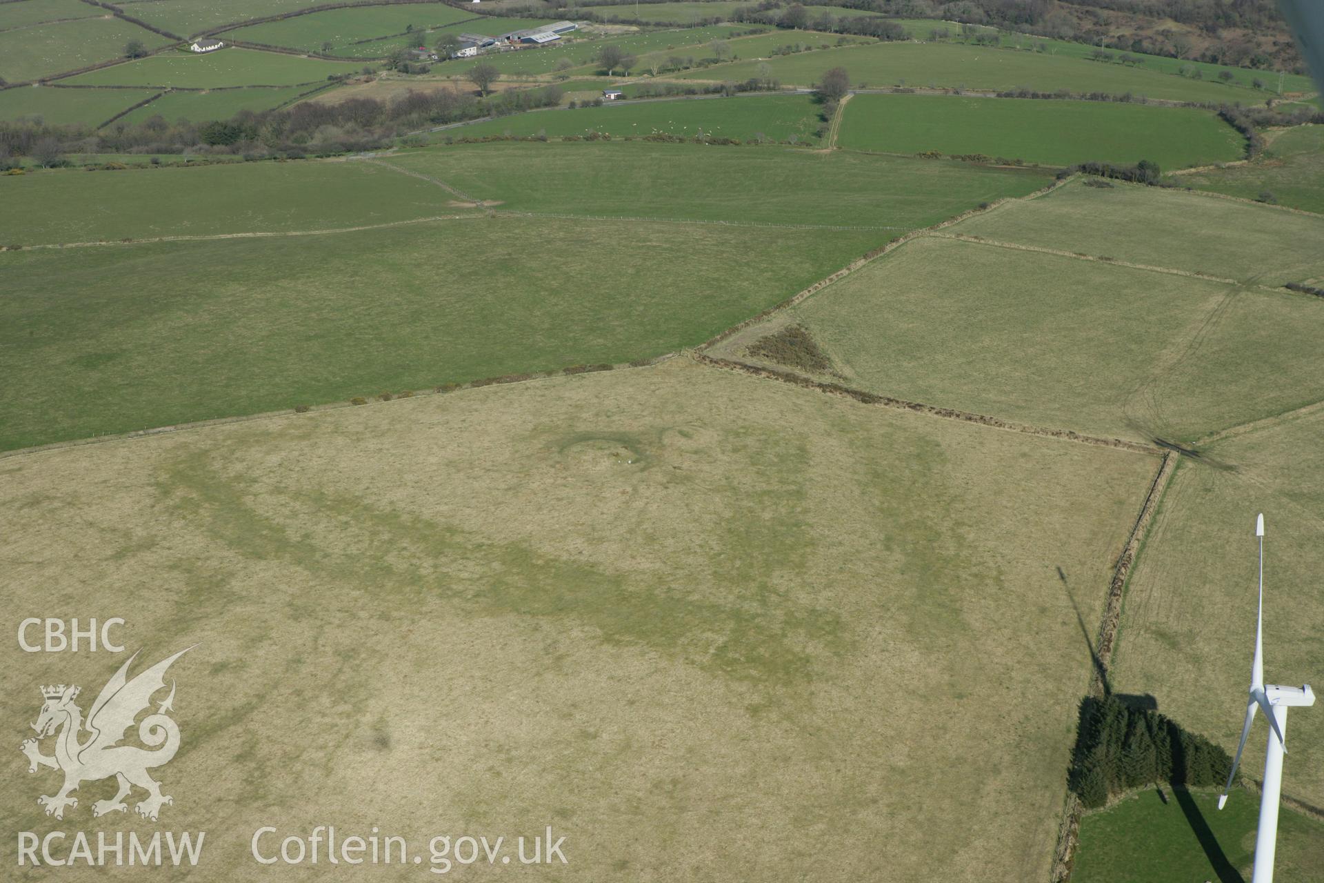RCAHMW colour oblique aerial photograph of Moelfre Crugiau II Round Barrow. Taken on 13 April 2010 by Toby Driver