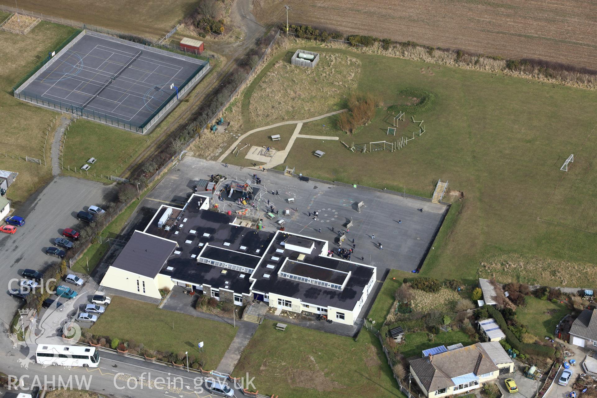 RCAHMW colour oblique aerial photograph of Roch Community School. Taken on 02 March 2010 by Toby Driver