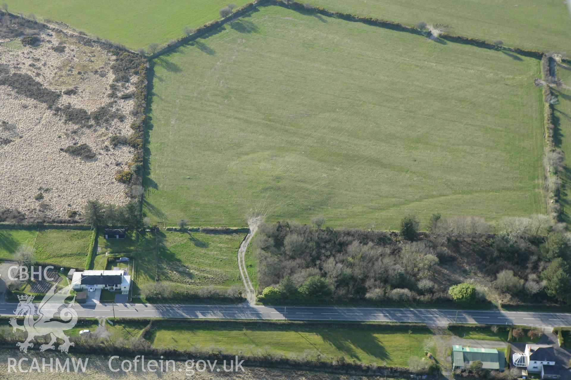 RCAHMW colour oblique aerial photograph of Precelly Farm Barrow. Taken on 13 April 2010 by Toby Driver
