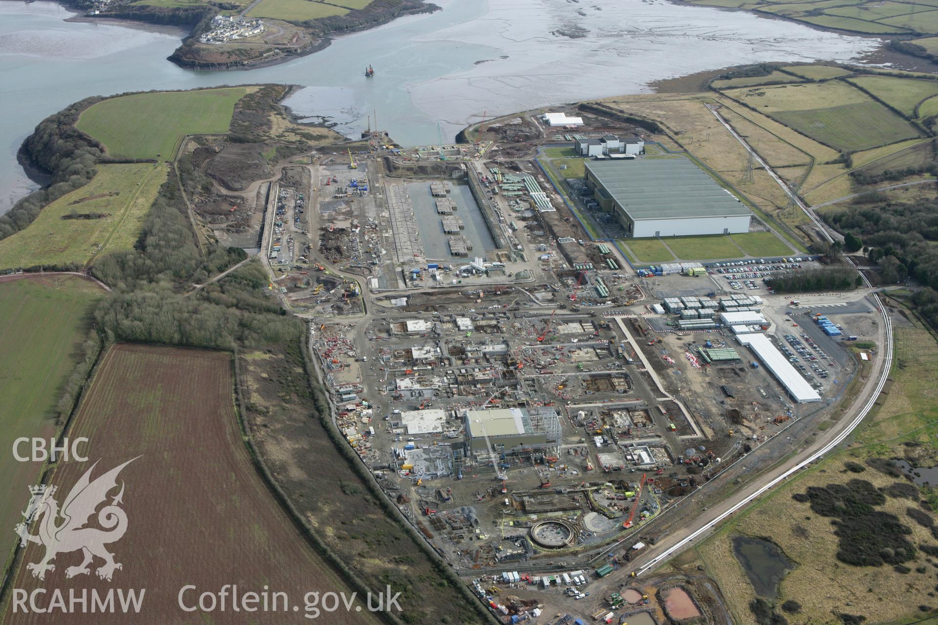 RCAHMW colour oblique aerial photograph of Pembroke Power Station site. Taken on 02 March 2010 by Toby Driver