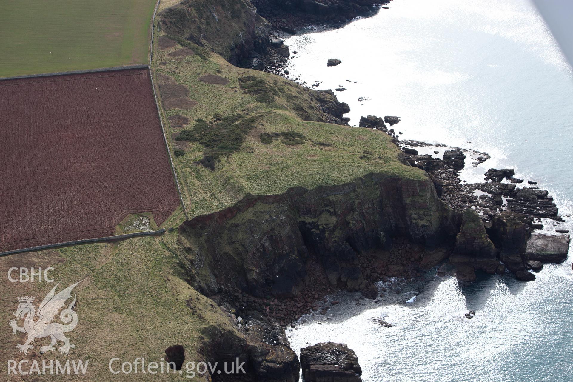 RCAHMW colour oblique aerial photograph of Tower Point Rath. Taken on 02 March 2010 by Toby Driver