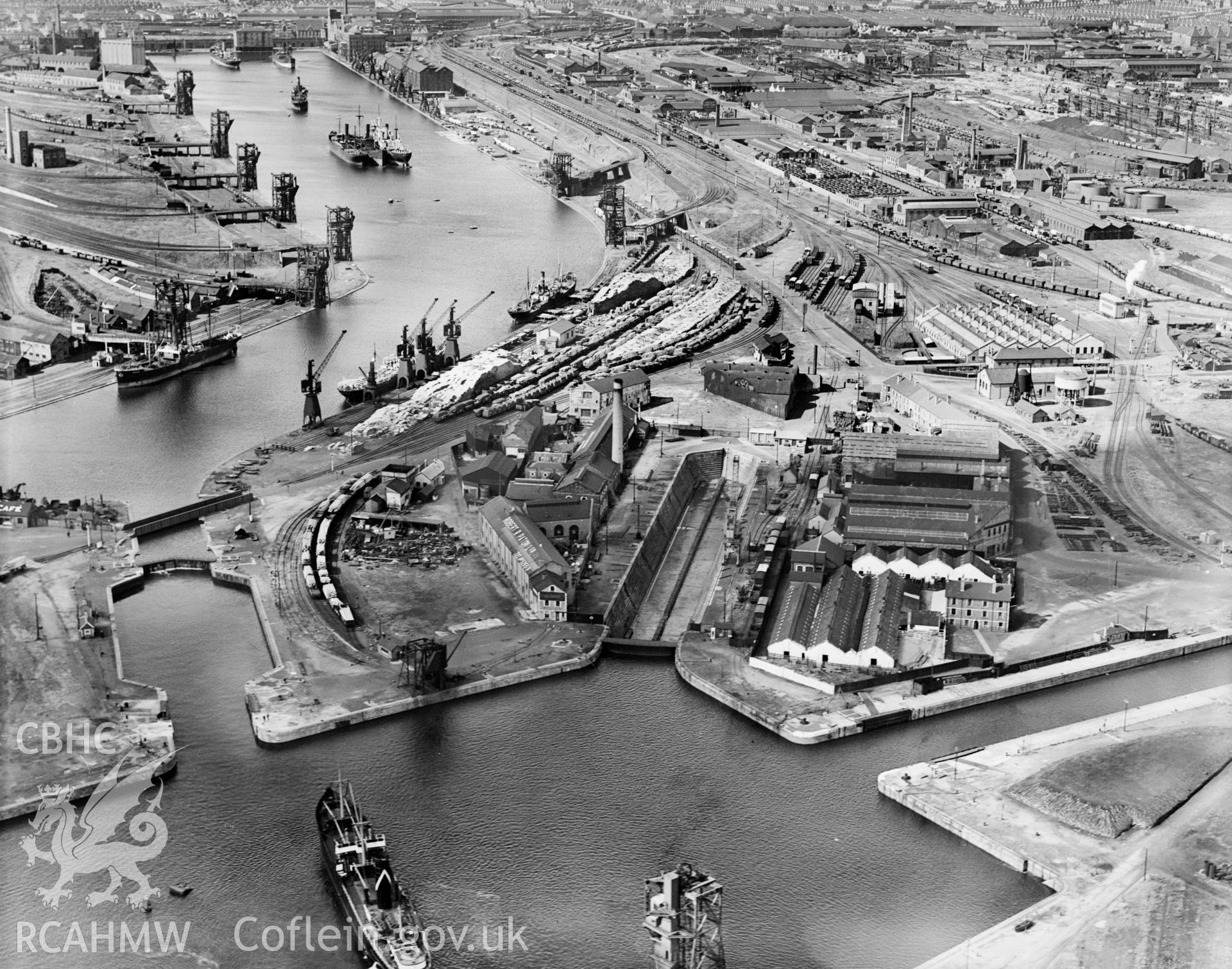 View of C.H. Bailey Ltd., dry dock owners & ship repairers and surrounding dockyard, Cardiff, oblique aerial view. 5?x4? black and white glass plate negative.