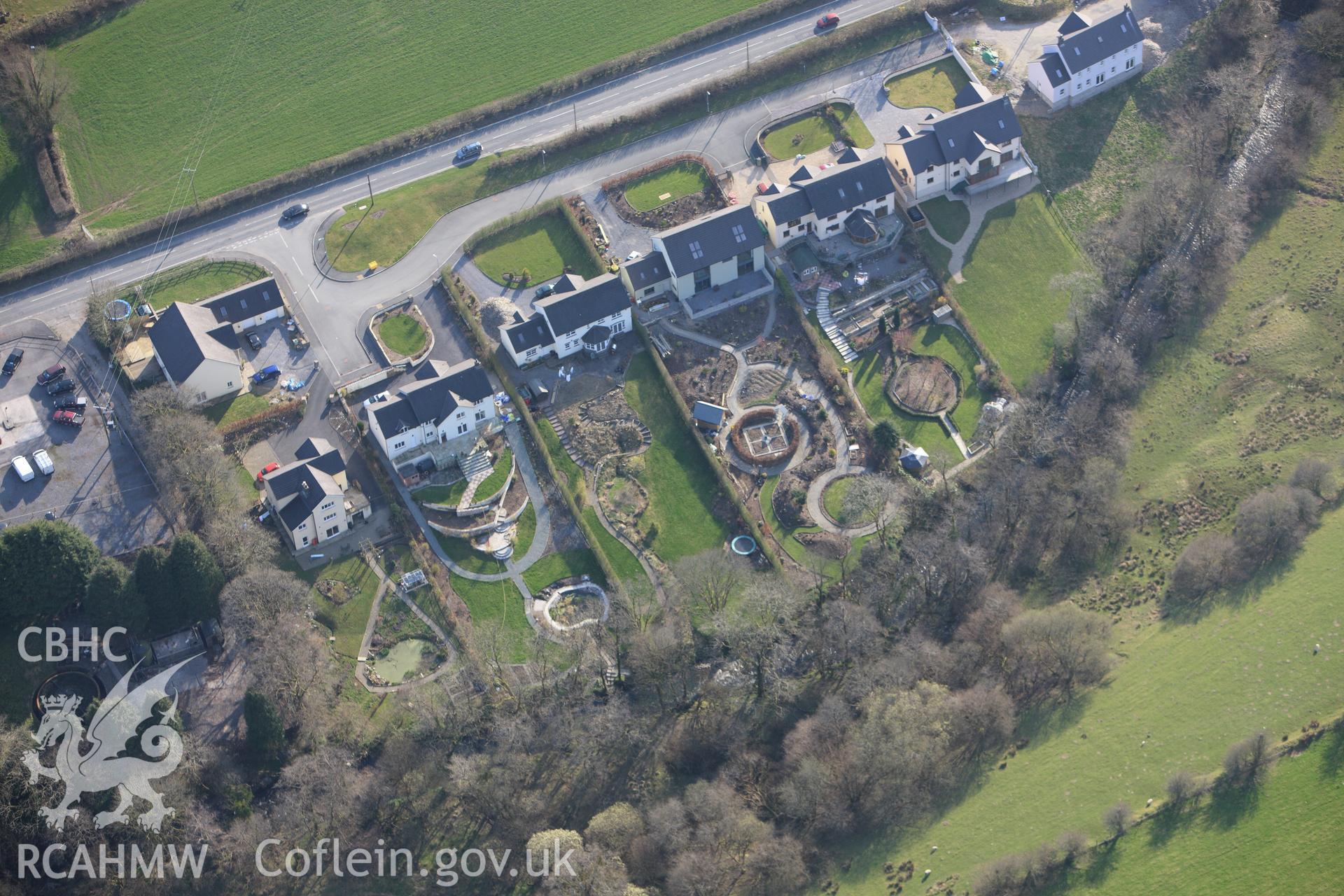 RCAHMW colour oblique aerial photograph of Cynwyl Elfed showing modern houses. Taken on 13 April 2010 by Toby Driver