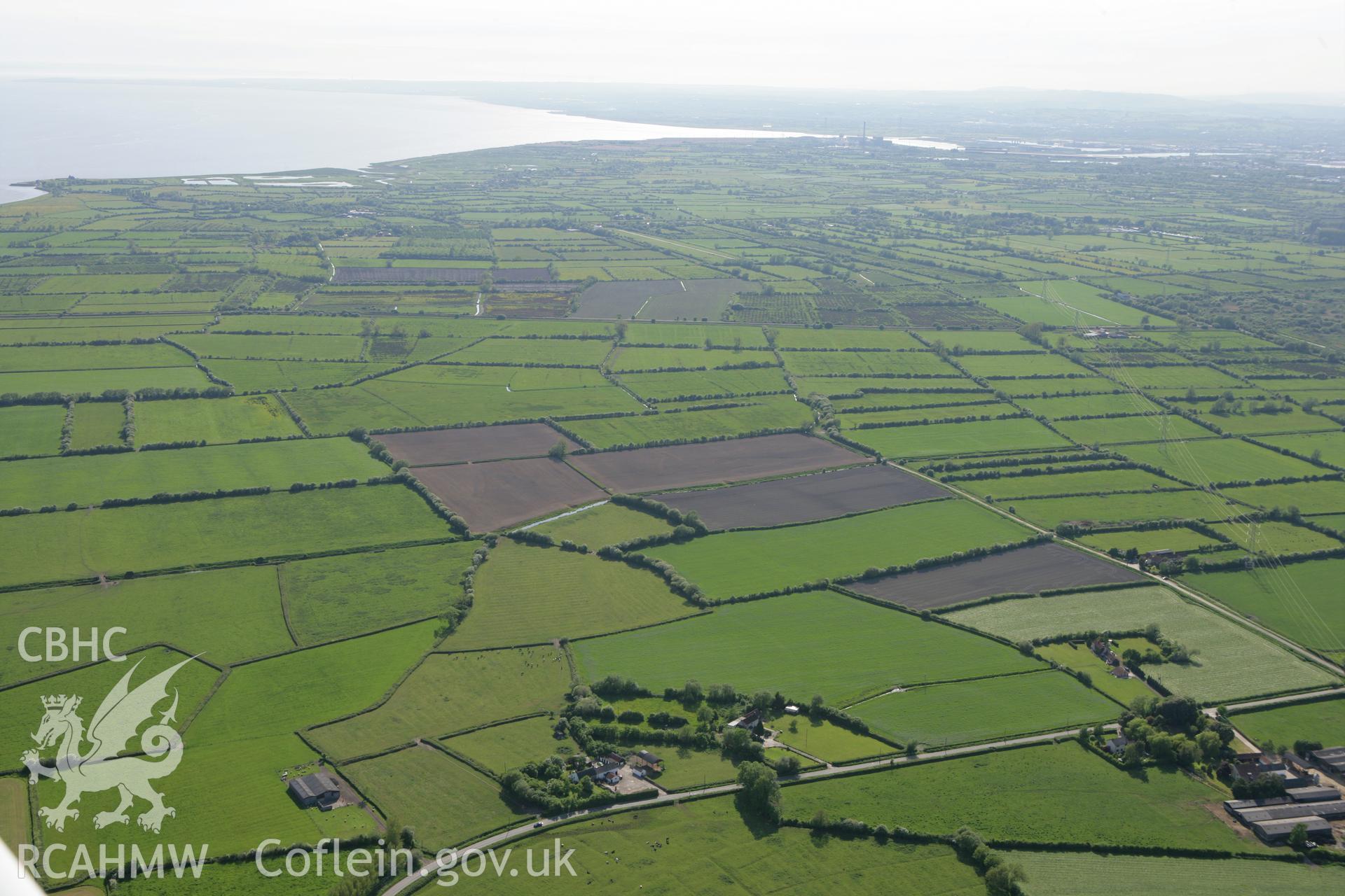 RCAHMW colour oblique photograph of Caldicot Levels looking west towards Newport Power Station. Taken by Toby Driver on 24/05/2010.