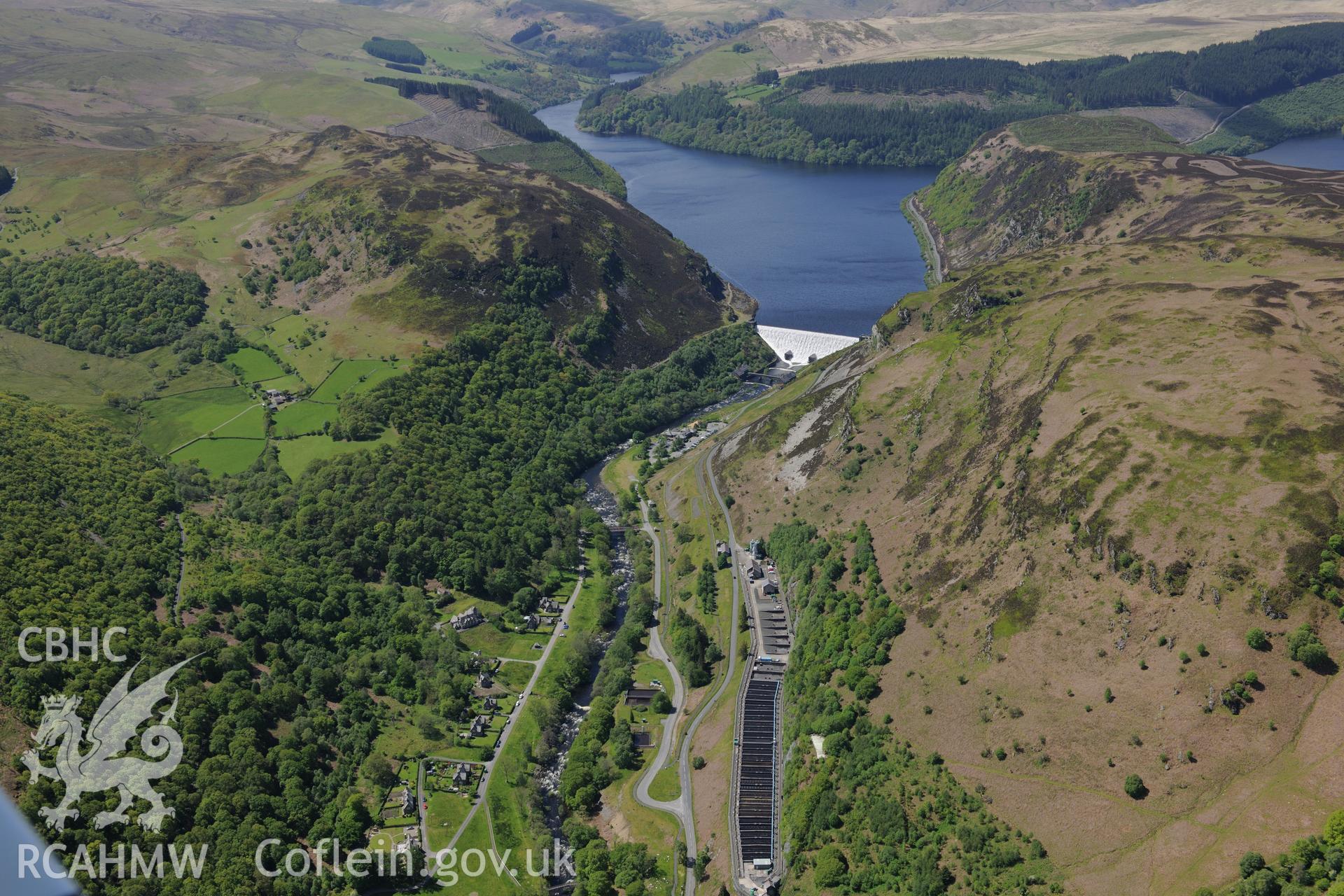 Landscape view of Caban Coch reservoir, dam and Elan Village, Birmingham Corporation Waterworks model village. Oblique aerial photograph taken during the Royal Commission?s programme of archaeological aerial reconnaissance by Toby Driver on 3rd June 2015.