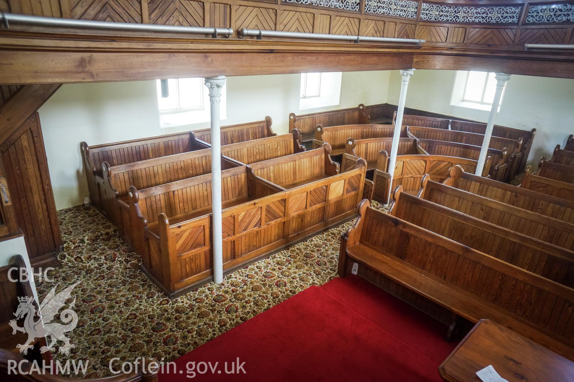 Digital colour photograph showing interior view of wooden pews on ground floor at Pentower Chapel, Fishguard, dated 2019. Photographed by Grace Elliott to meet a condition attached to a planning application.