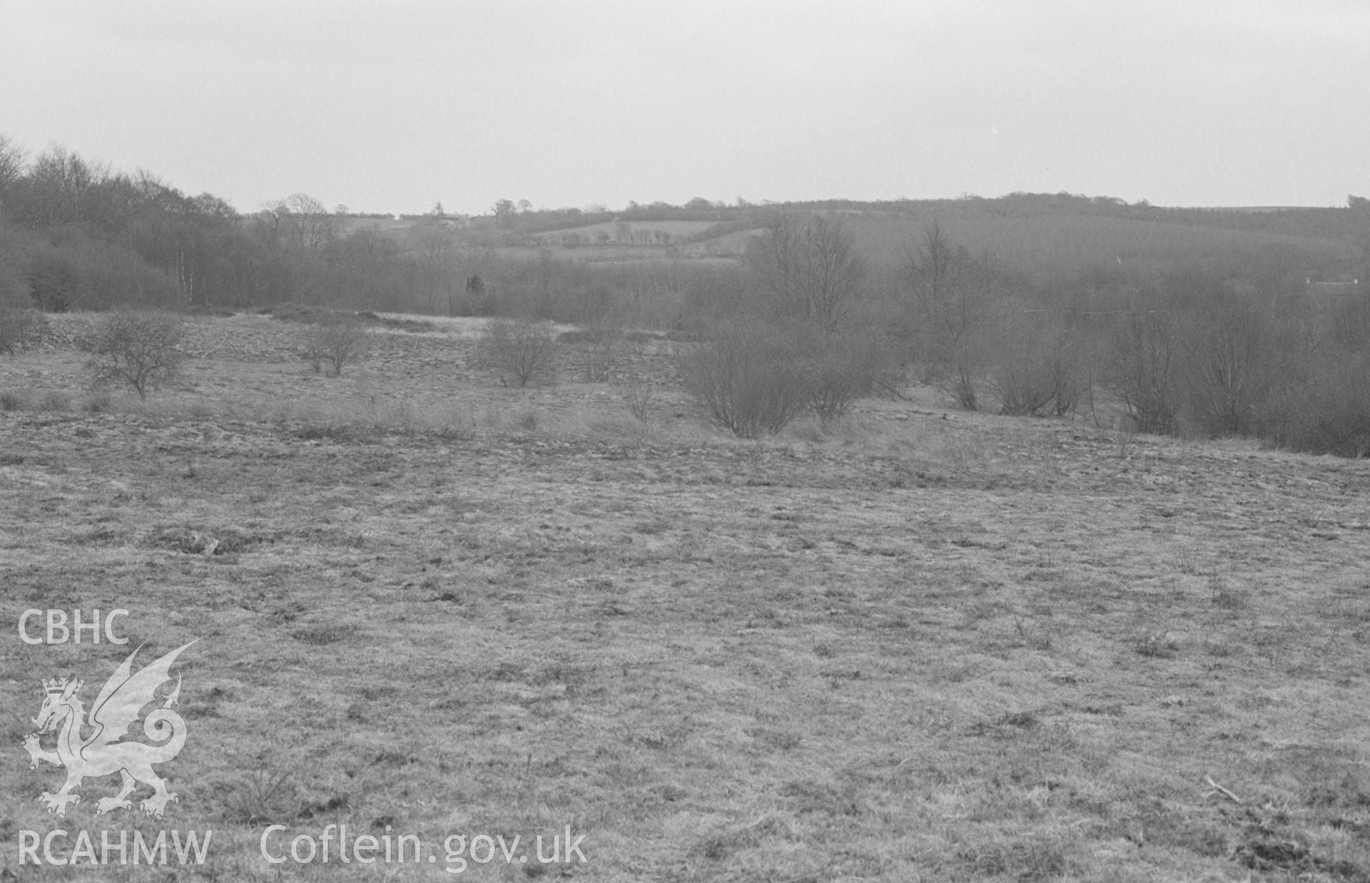Digital copy of a black and white negative showing panorama of Llangybi Common; Nant-glas-fach on left, Nant Meurig in bushes in centre. Photographed by Arthur O. Chater in April 1968. [2 of 3]