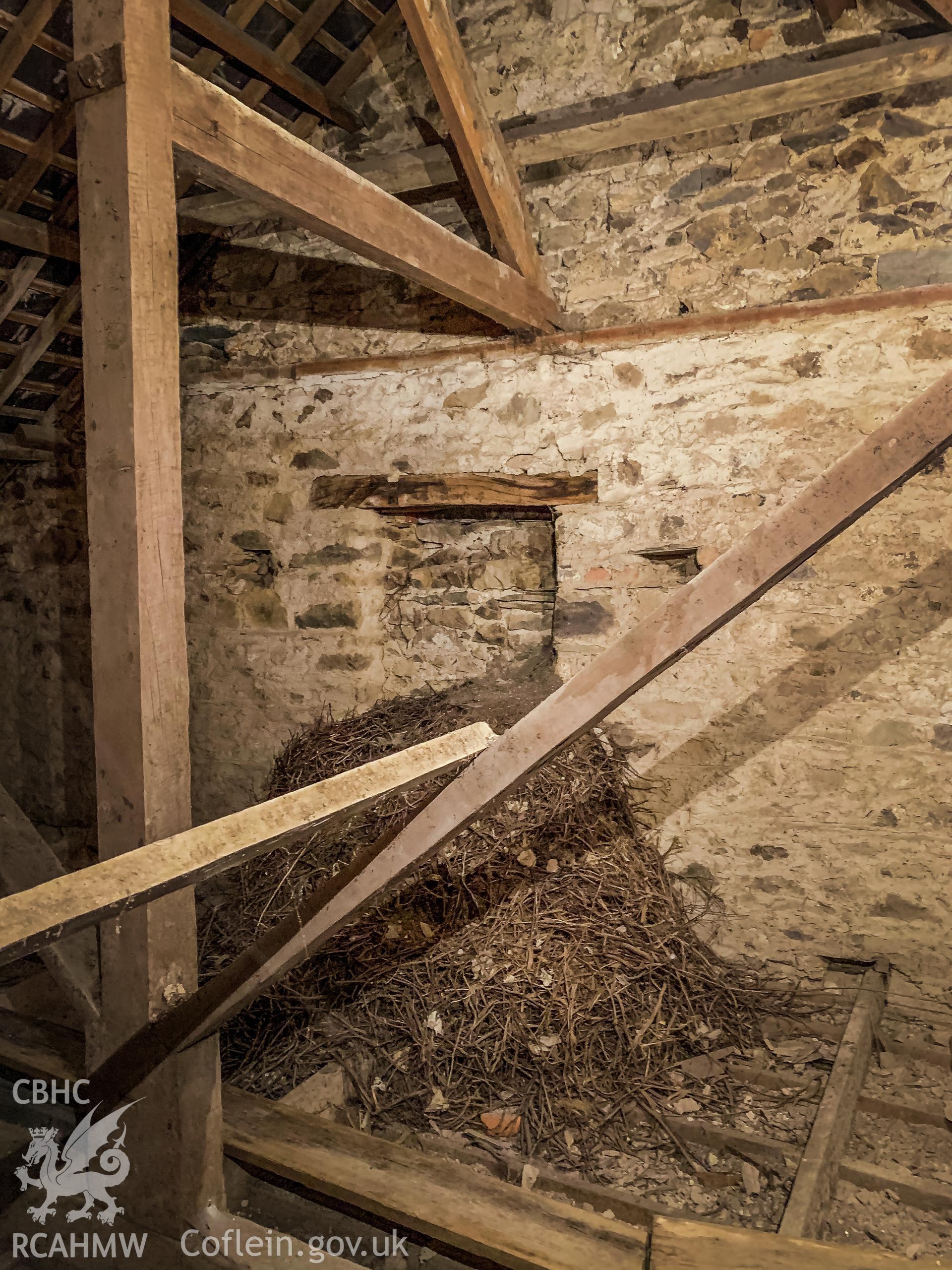 Digital colour photograph showing interior view of wooden beams and the wall under the roof at Pentower Chapel, Fishguard, dated 2019. Photographed by Grace Elliott to meet a condition attached to a planning application.