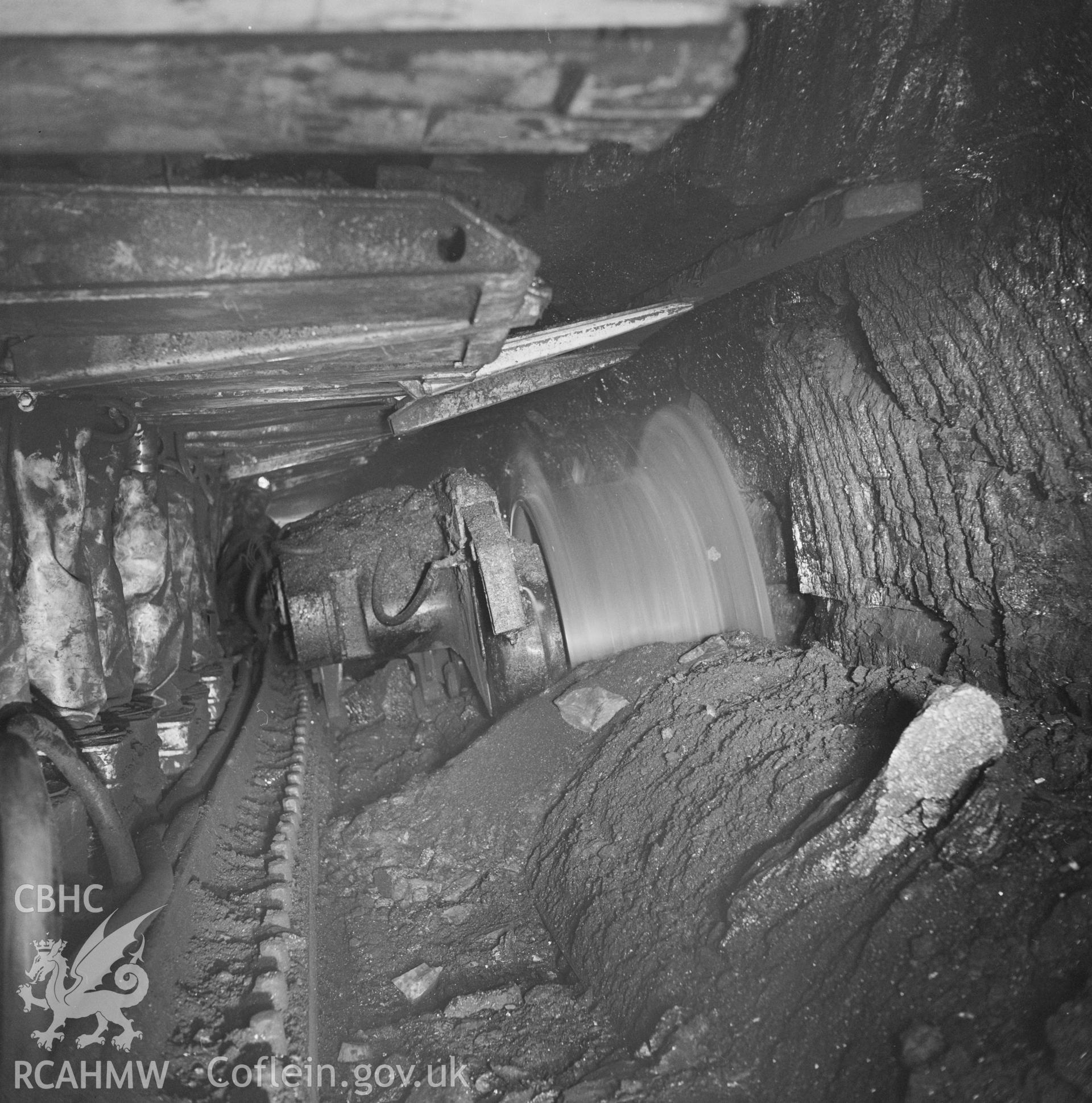 Digital copy of an acetate negative showing shearer on coal face at Britannia Colliery, from the John Cornwell Collection.