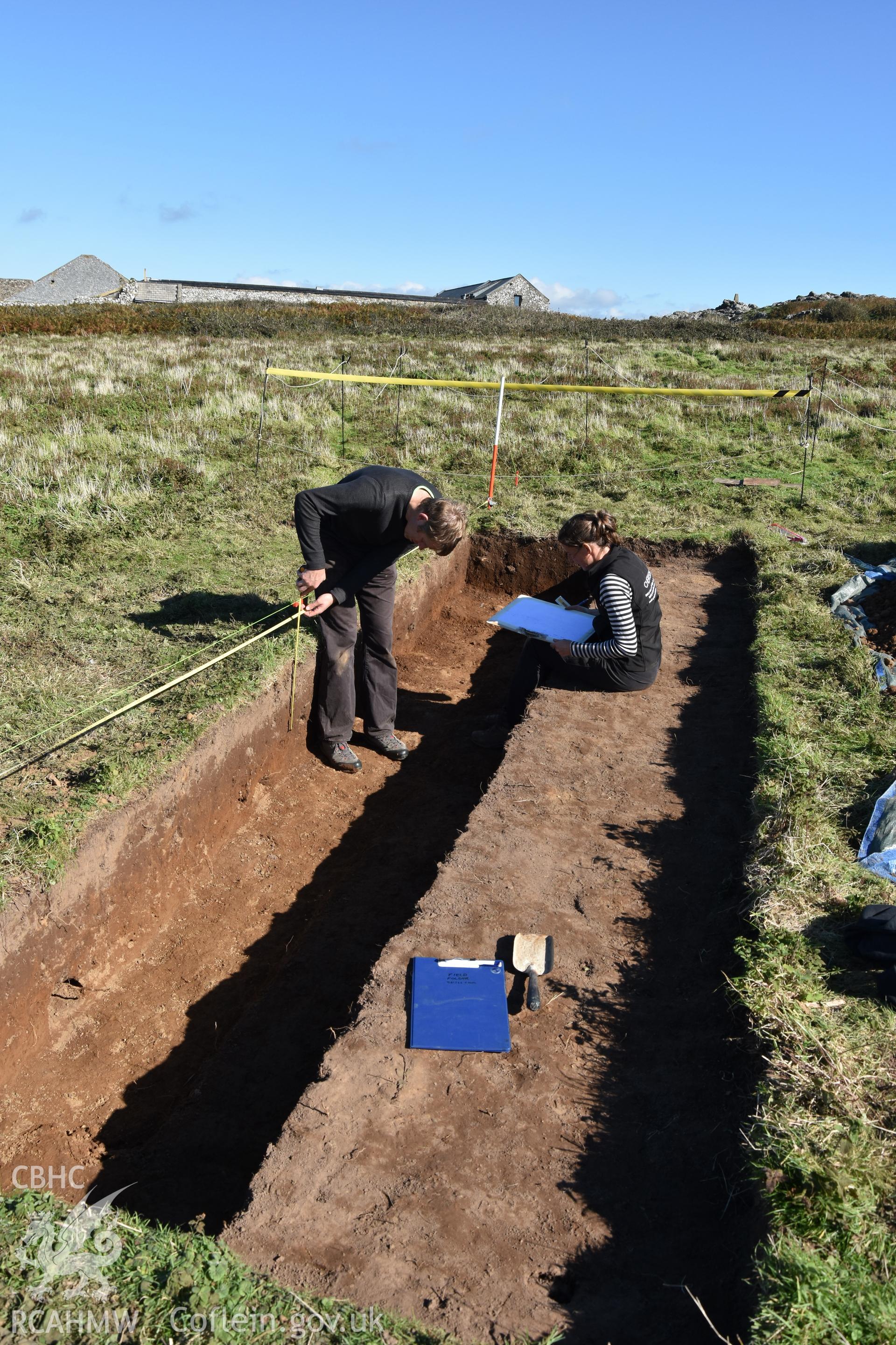 Investigator's photography showing the evaluation excavation of a geophysical anomaly in Well Meadow, Skomer Island, between 25-27th Sept 2018 as part of the Skomer Island Project. Section drawing in progress with L. Barker and B. Johnston.
