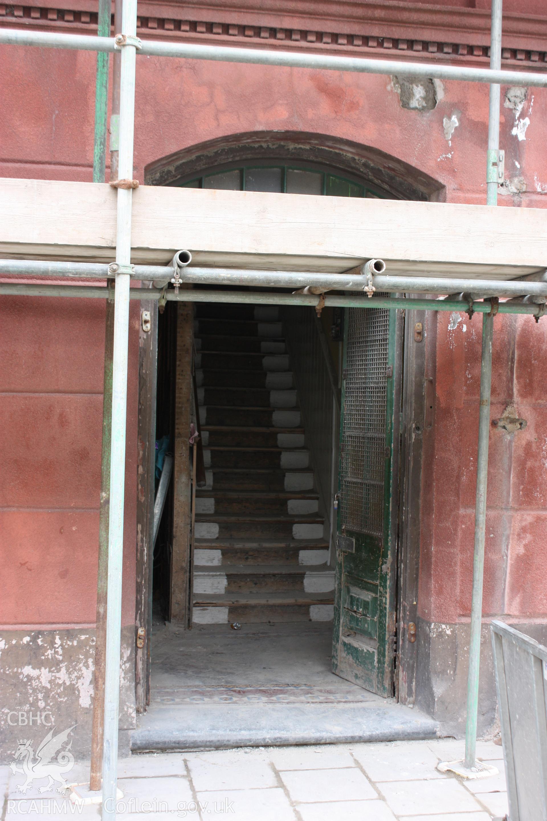 Colour photograph showing interior stairs leading from ground to first floor at the Old Auction Rooms/ Liberal Club in Aberystwyth. Photographic survey conducted by Geoff Ward on 9th June 2010 during repair work prior to conversion into flats.
