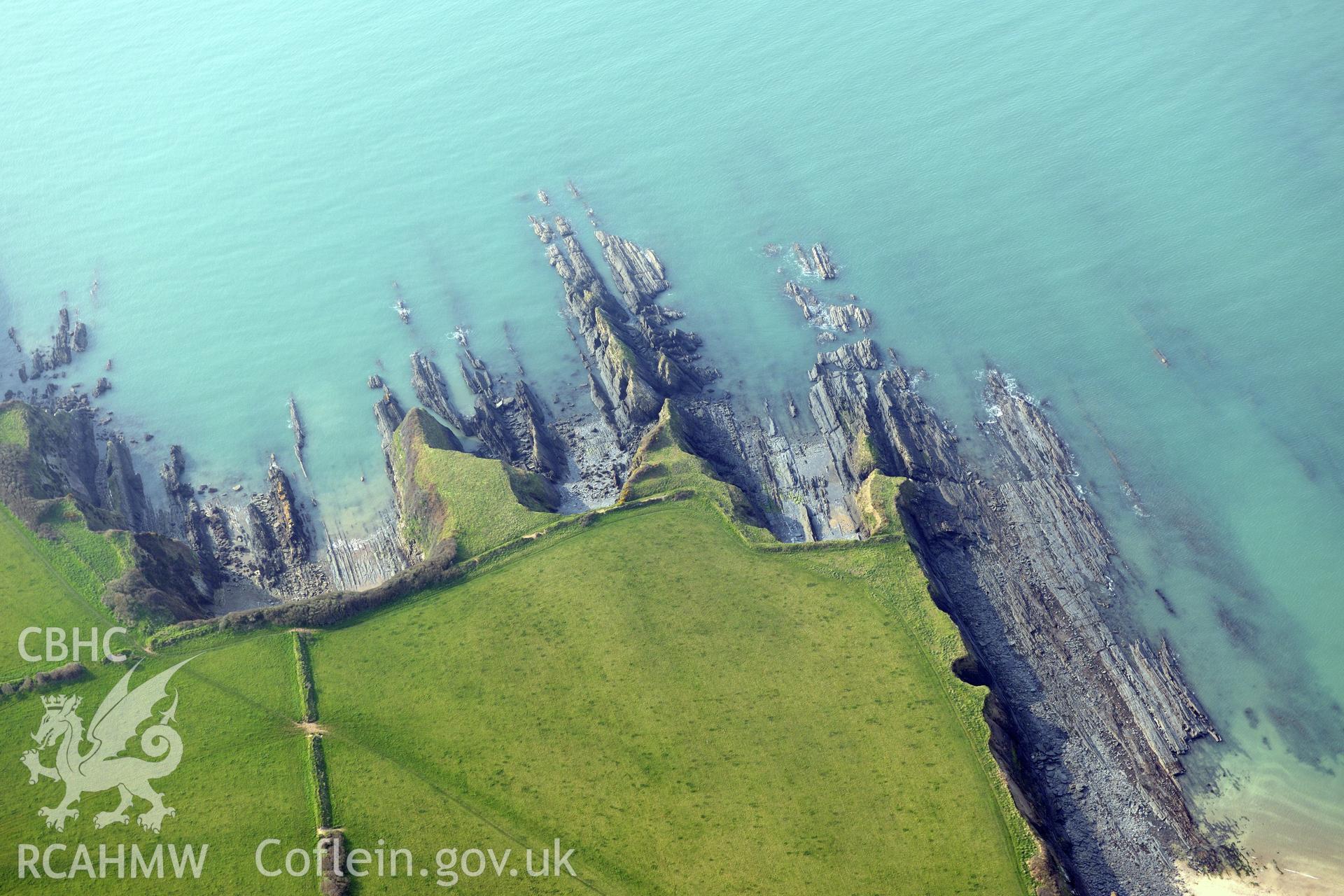 Royal Commission aerial photograph of West Angle Bay promontory fort taken on 27th March 2017. Baseline aerial reconnaissance survey for the CHERISH Project. ? Crown: CHERISH PROJECT 2017. Produced with EU funds through the Ireland Wales Co-operation Programme 2014-2020. All material made freely available through the Open Government Licence.