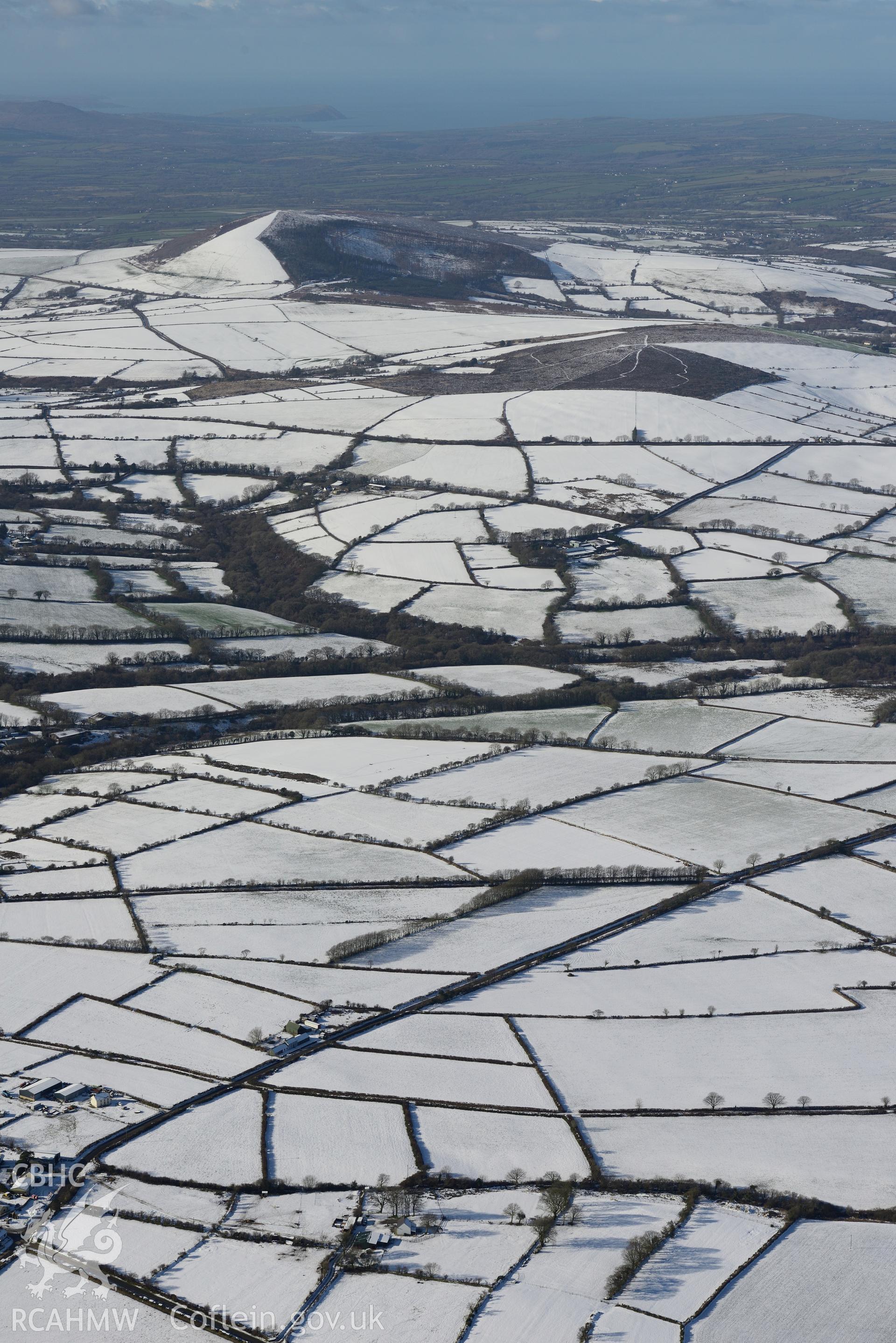 Snow-covered landscape around Cross Inn Farm, about six miles south west of Newcastle Emlyn. Oblique aerial photograph taken during the Royal Commission's programme of archaeological aerial reconnaissance by Toby Driver on 4th February 2015.