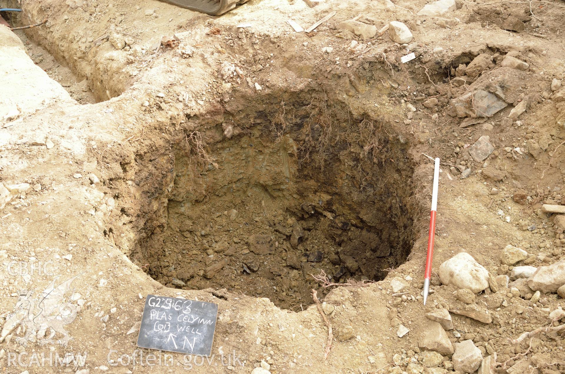 'Well excavated and cut fully exposed, viewed from the south west.' Photographed by Gwynedd Archaeological Trust as part of archaeological mitigation report for well at Plas Celynin, Henryd, Conwy, on 6th August 2018. Project no. G2568.