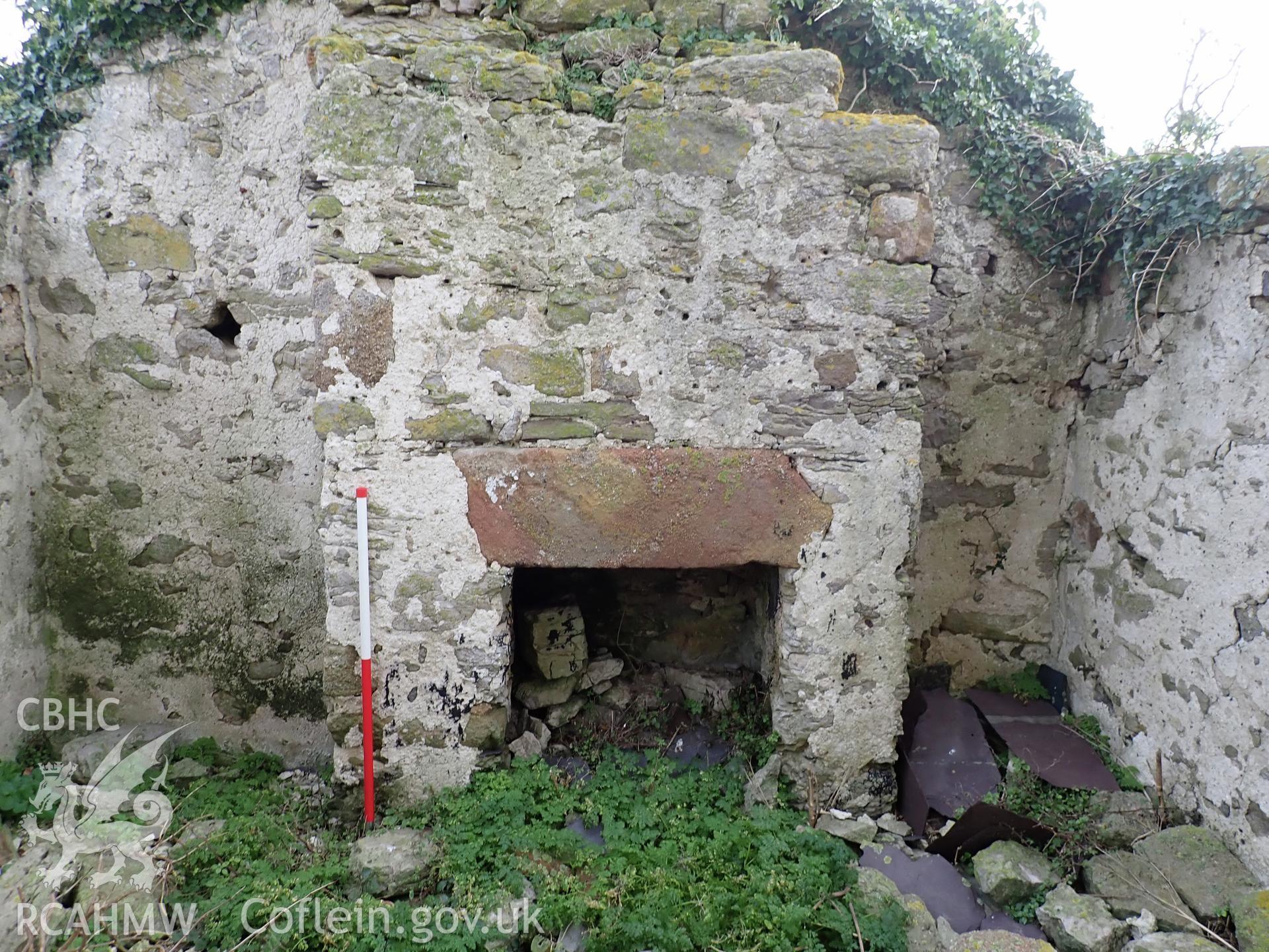 Investigator's photographic survey of the church on Puffin Island or Ynys Seiriol for the CHERISH Project. View of the ruinous cottage on the site of the transept to the south of the tower. ? Crown: CHERISH PROJECT 2018. Produced with EU funds through the Ireland Wales Co-operation Programme 2014-2020. All material made freely available through the Open Government Licence.