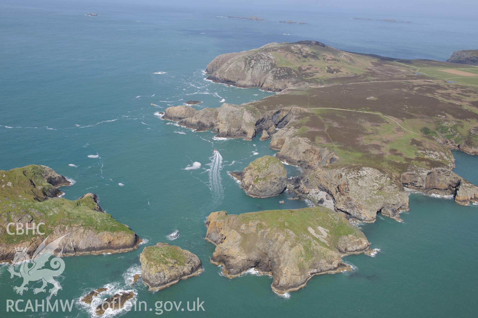 Ramsey Island, and the smaller Ynys Bery and Ynys Cantwr, off the coast near St Davids. Oblique aerial photograph taken during the Royal Commission's programme of archaeological aerial reconnaissance by Toby Driver on 13th May 2015.