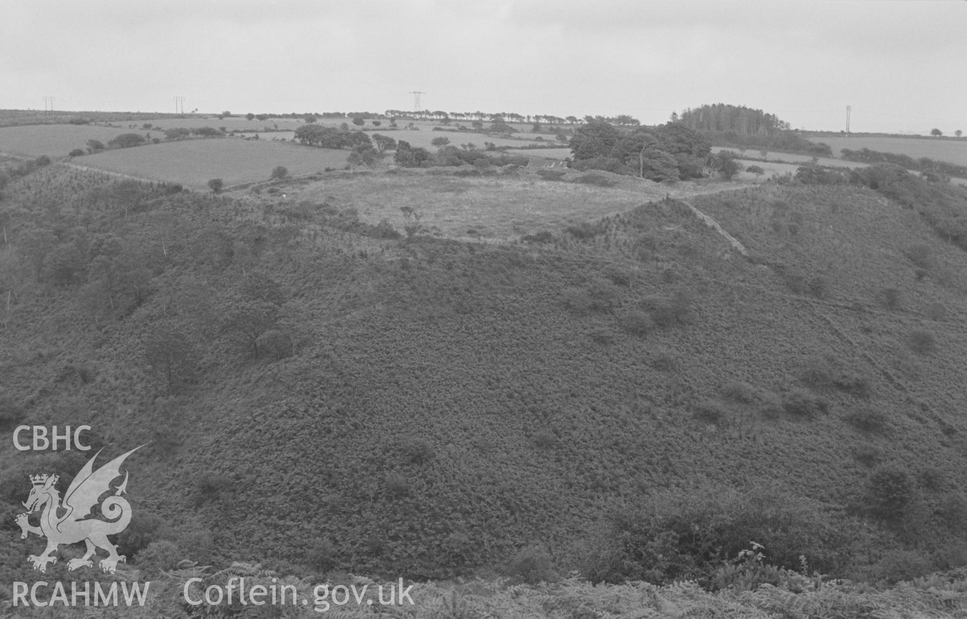 Digital copy of a black and white negative showing Carn Wen promontory iron-age camp, 2.3km east of Ffostrasol, rampart is a quarter-circle dry stone bank. Photographed by Arthur O. Chater in August 1967. (View looking east from Grid Reference SN 394 471).
