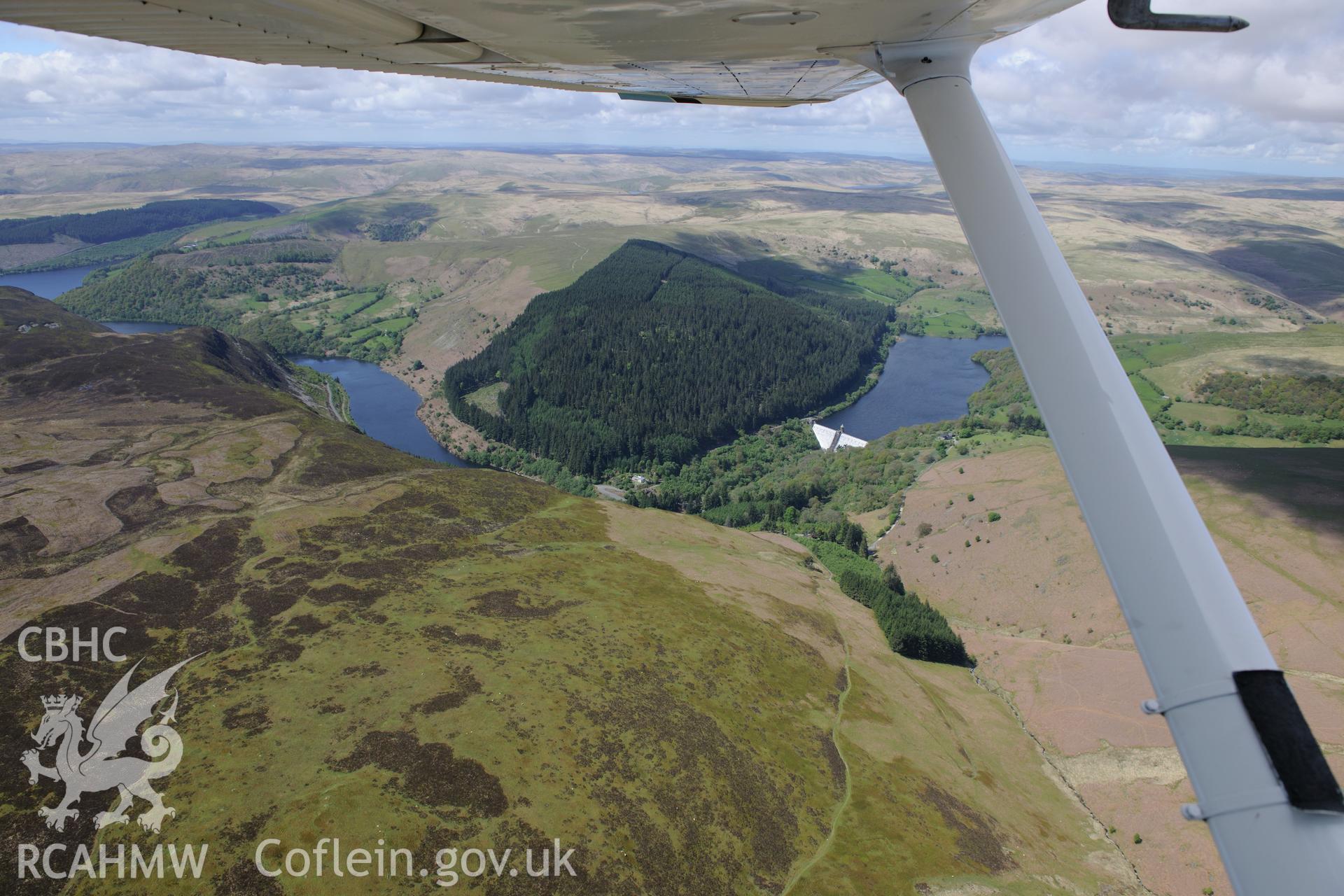 Pen-y-Garreg reservoir and dam. Oblique aerial photograph taken during the Royal Commission's programme of archaeological aerial reconnaissance by Toby Driver on 3rd June 2015.