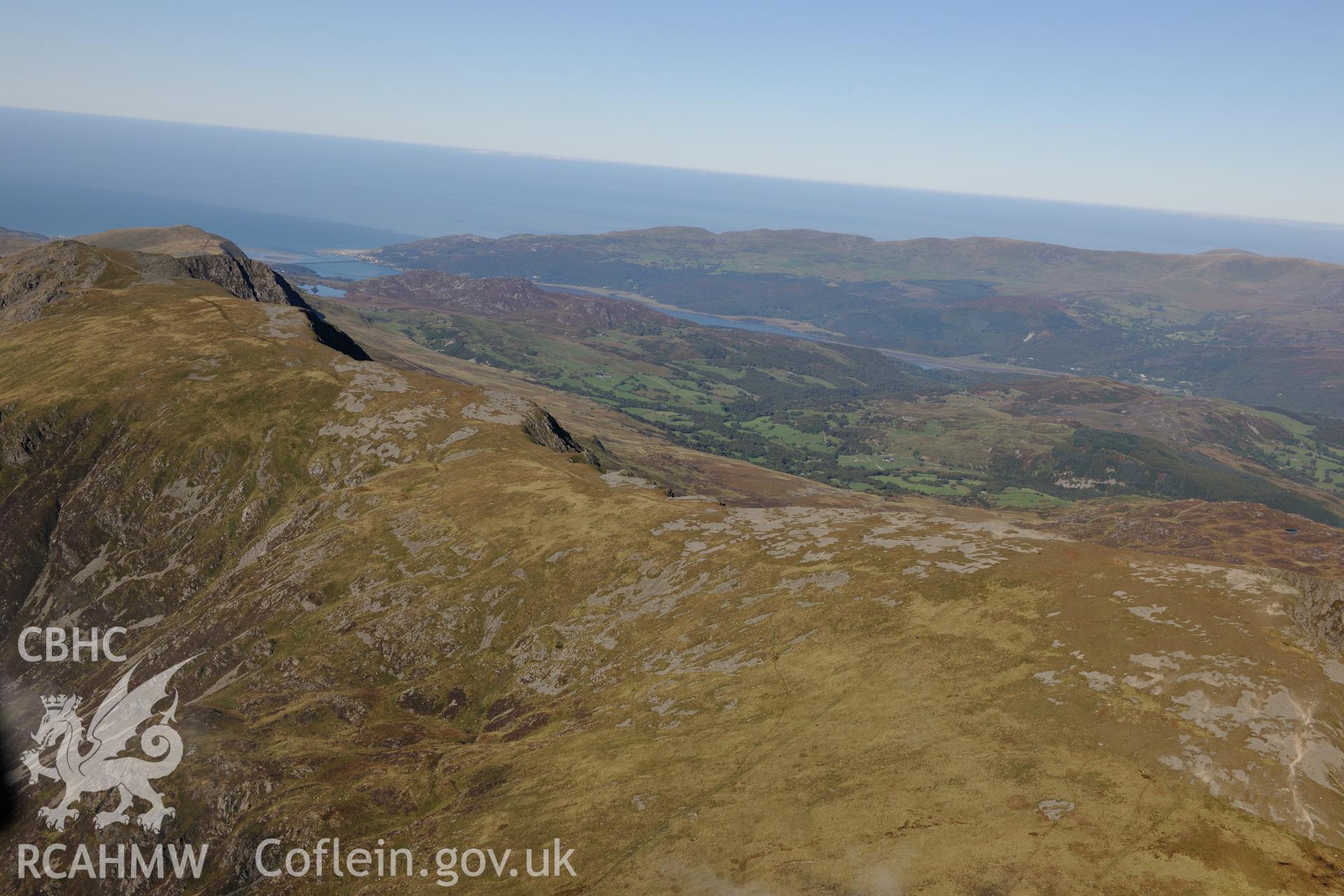 Cadair Idris with the Mawddach estuary beyond. Oblique aerial photograph taken during the Royal Commission's programme of archaeological aerial reconnaissance by Toby Driver on 2nd October 2015.