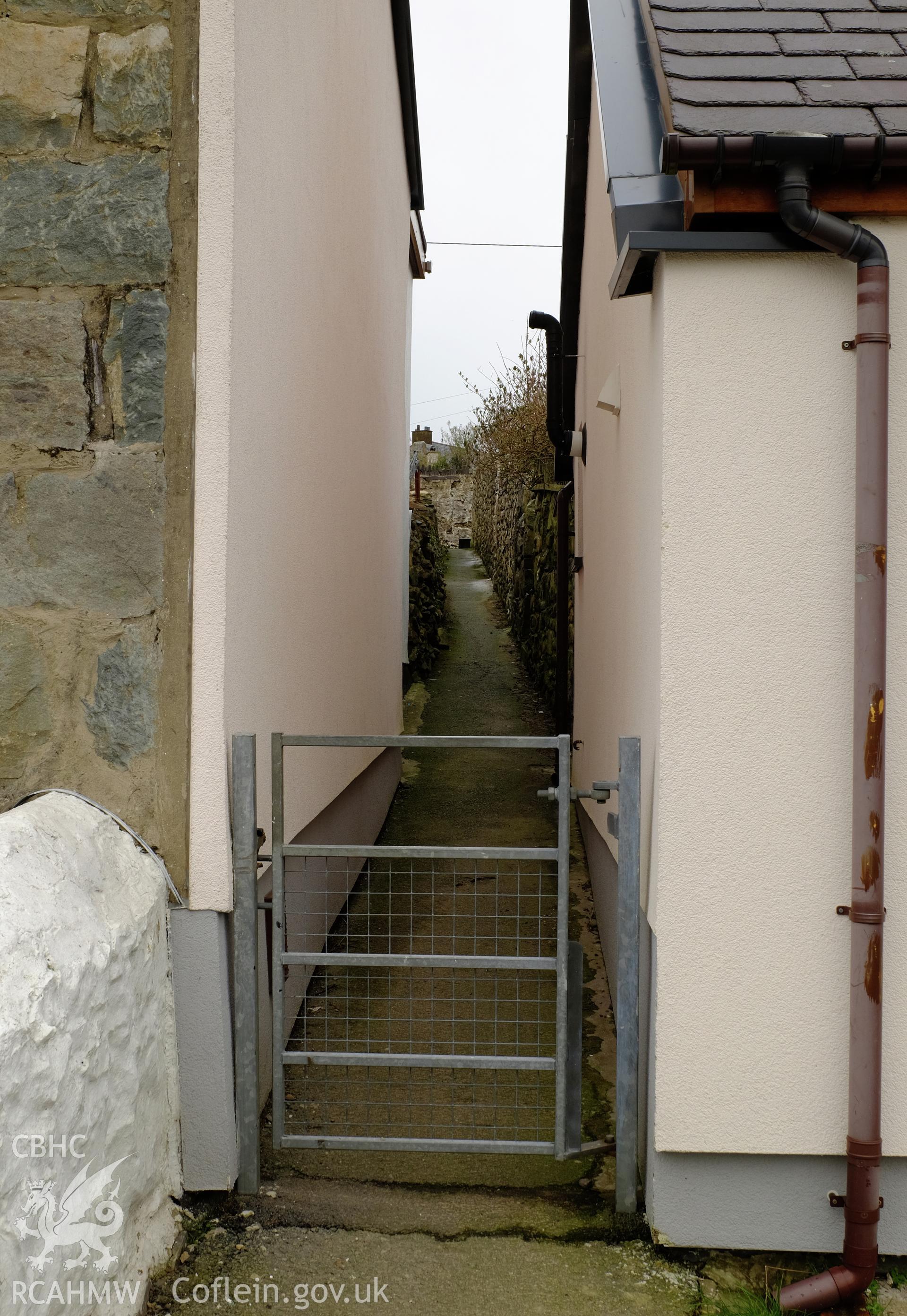 Colour photograph showing view looking north at an alleyway in Clwt-y-Bont, Deiniolen, produced by Richard Hayman 2nd March 2017