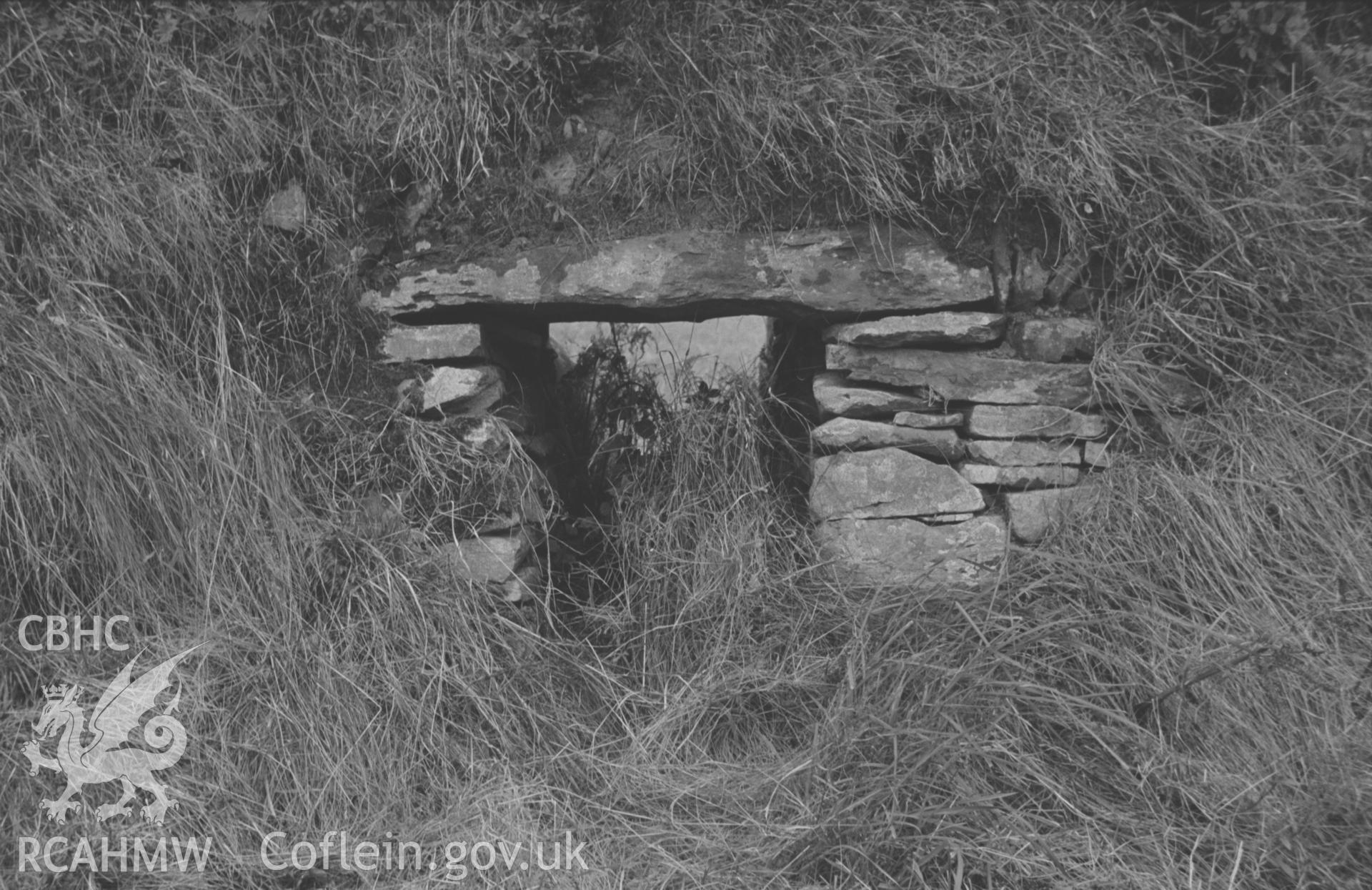Digital copy of a black and white negative showing 'cripple hole' in bank on west side of Trefilan - Cross Inn B4337 road just south of Gwastad Farm Crossroads. Photographed by Arthur O. Chater in September 1966 looking west from Grid Reference SN 542 608.