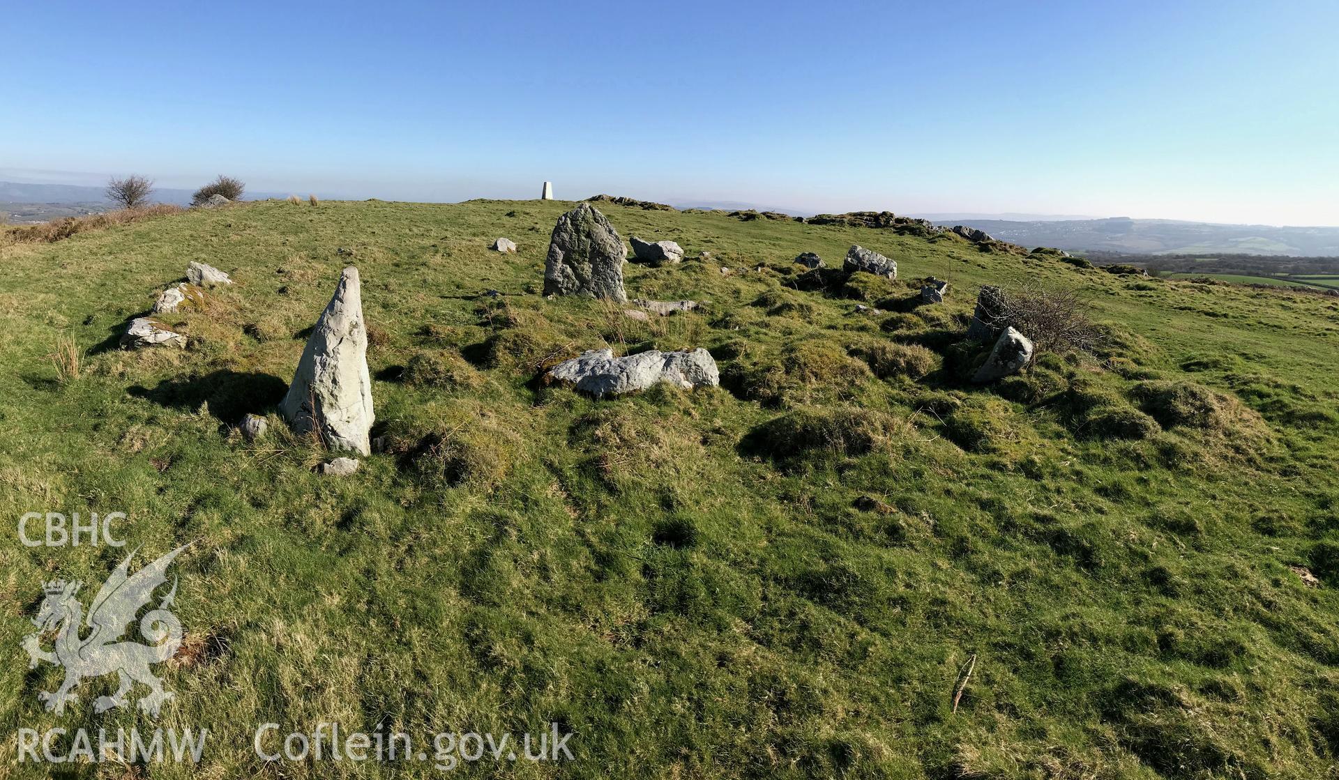 Digital colour photograph of a round cairn or kerb circle on Mynydd Llangyndeyrn, east of Crwbin, taken by Paul R. Davis on 26th February 2019.