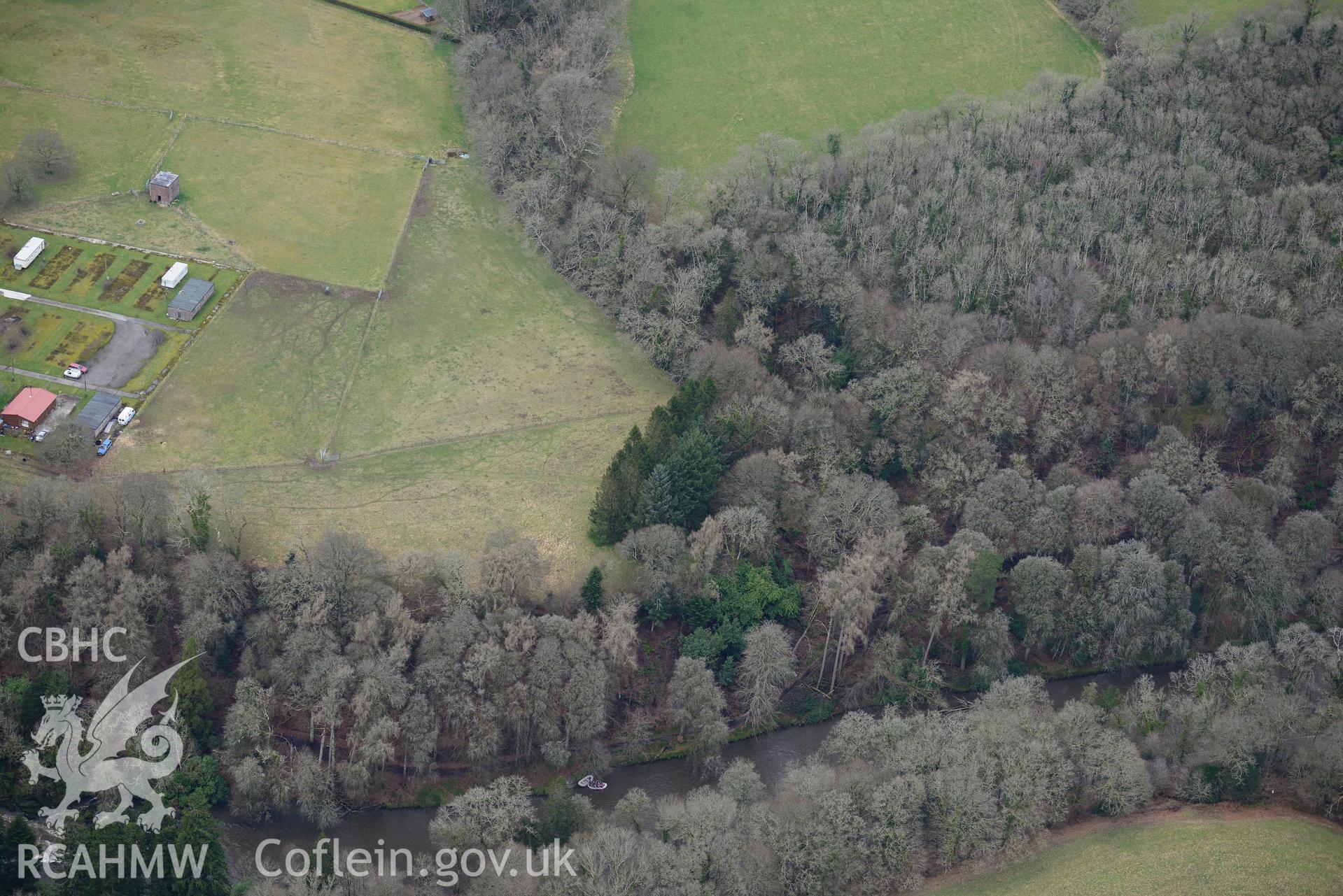 Caerau Hillfort and Henllan Bridge prisoner of war camp, Henllan, between Newcastle Emlyn and Llandysul. Oblique aerial photograph taken during the Royal Commission's programme of archaeological aerial reconnaissance by Toby Driver on 13th March 2015.