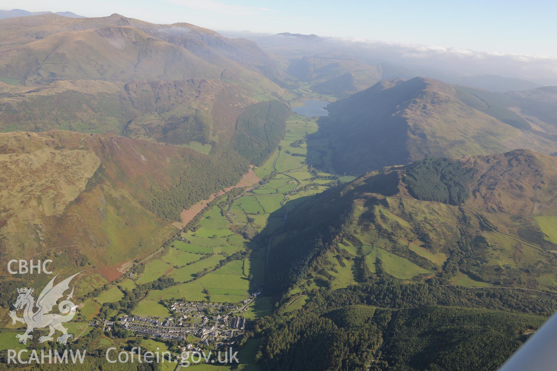 Abergynolwyn with Tal-y-Llyn lake beyond. Oblique aerial photograph taken during the Royal Commission's programme of archaeological aerial reconnaissance by Toby Driver on 2nd October 2015.