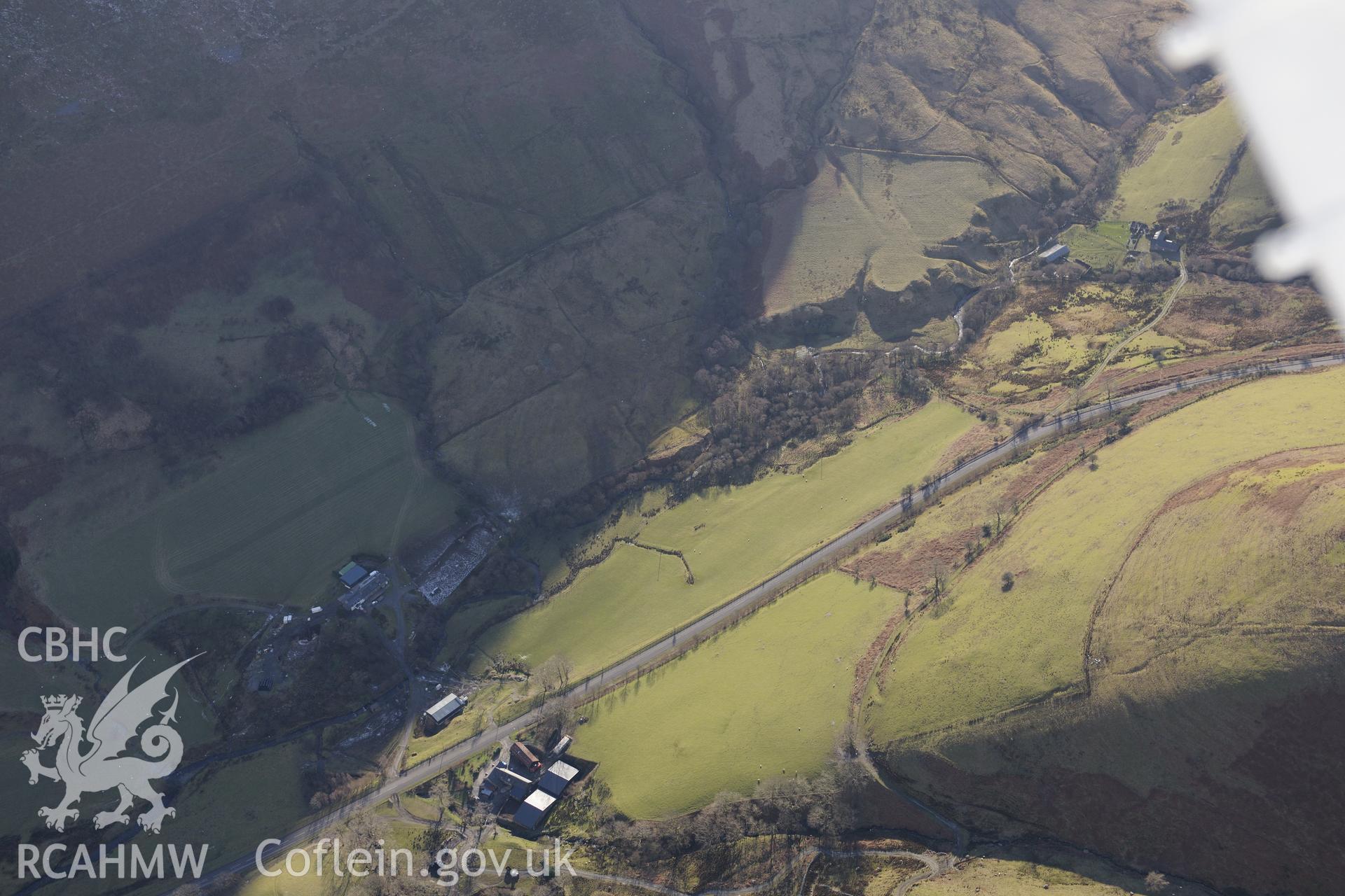 View of Llawr-y-Cae farm (top) and Penantigi Isaf farm (below) from the north. Oblique aerial photograph taken during the Royal Commission's programme of archaeological aerial reconnaissance by Toby Driver on 4th February 2015.