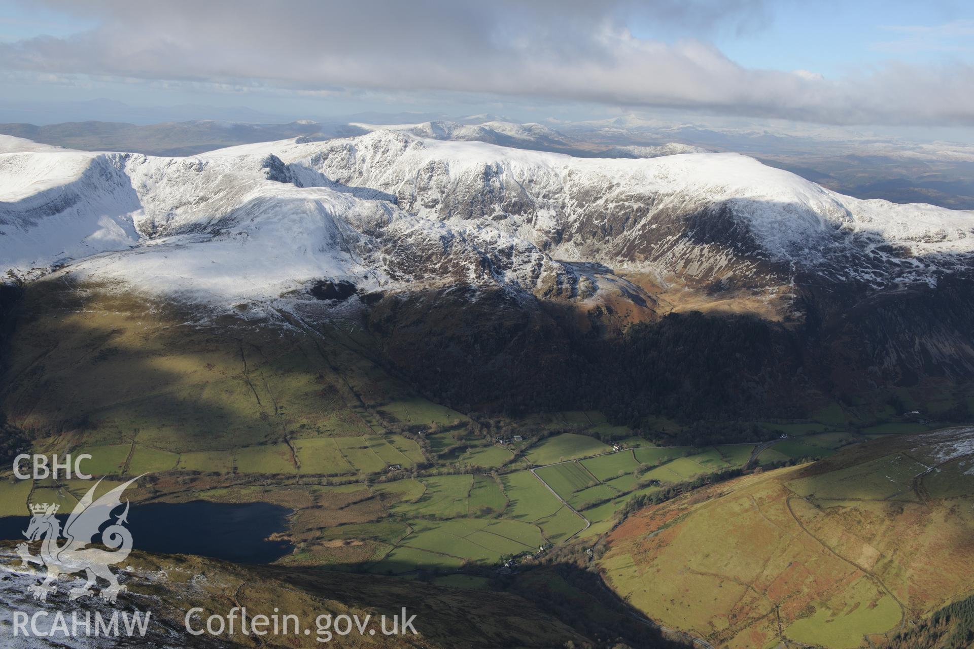 The snow-capped Cadair Idris, Penygadair Summit and Tal-y-Llyn lake, near Dolgellau. Oblique aerial photograph taken during the Royal Commission's programme of archaeological aerial reconnaissance by Toby Driver on 4th February 2015.