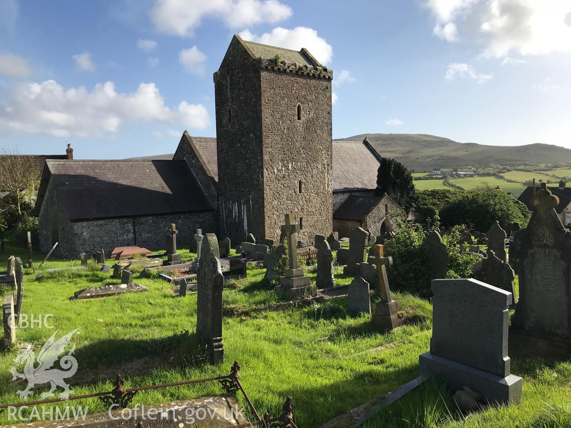 Colour photo showing external view of St. Cenydd's Church and graveyard, Llangenydd, taken by Paul R. Davis, 10th May 2018.