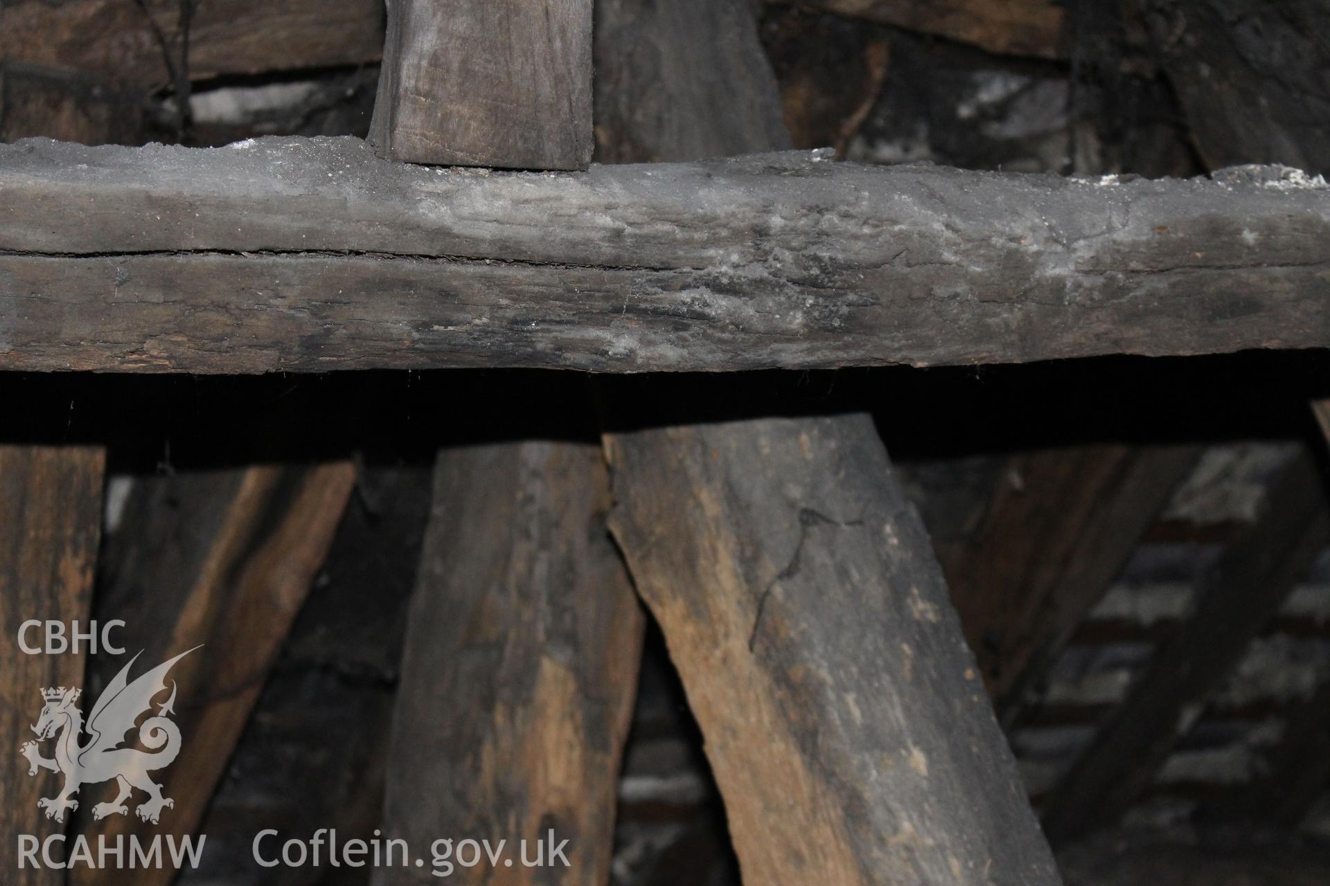 Colour photograph showing detail of timber frame in attic at 5 to 7 Mwrog Street, Ruthin. Photographed during survey conducted by Geoff Ward on 30th May 2014.