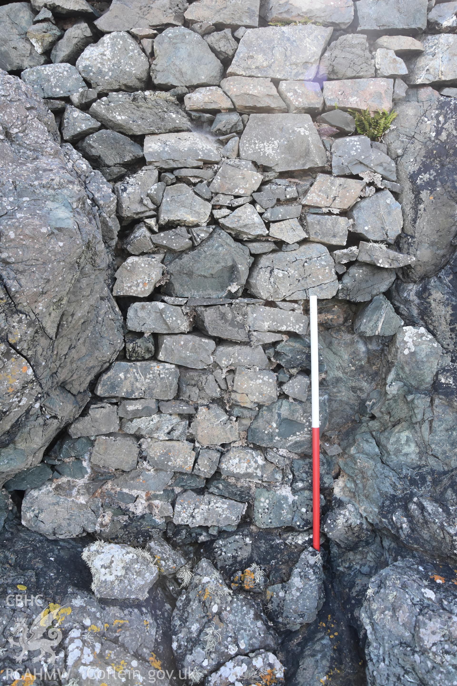 Penmaenmelyn copper mine. Detail of stone walling in rock crevice, western revetment wall.Investigator?s photographic survey for the CHERISH Project. ? Crown: CHERISH PROJECT 2019. Produced with EU funds through the Ireland Wales Co-operation Programme 2014-2020. All material made freely available through the Open Government Licence.