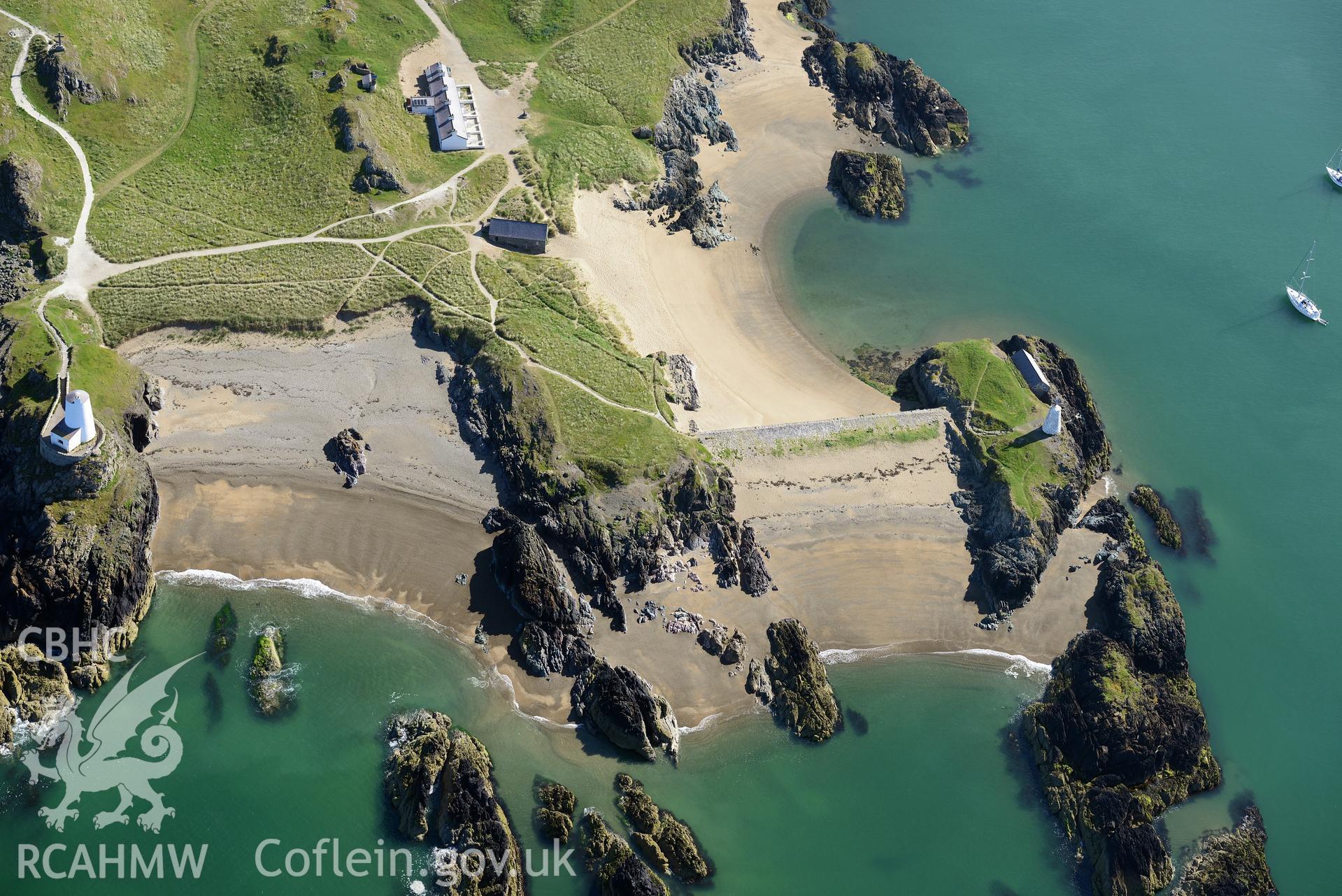 The lighthouse, tower, and pilot's house on Llanddwyn Island. Oblique aerial photograph taken during the Royal Commission's programme of archaeological aerial reconnaissance by Toby Driver on 23rd June 2015.