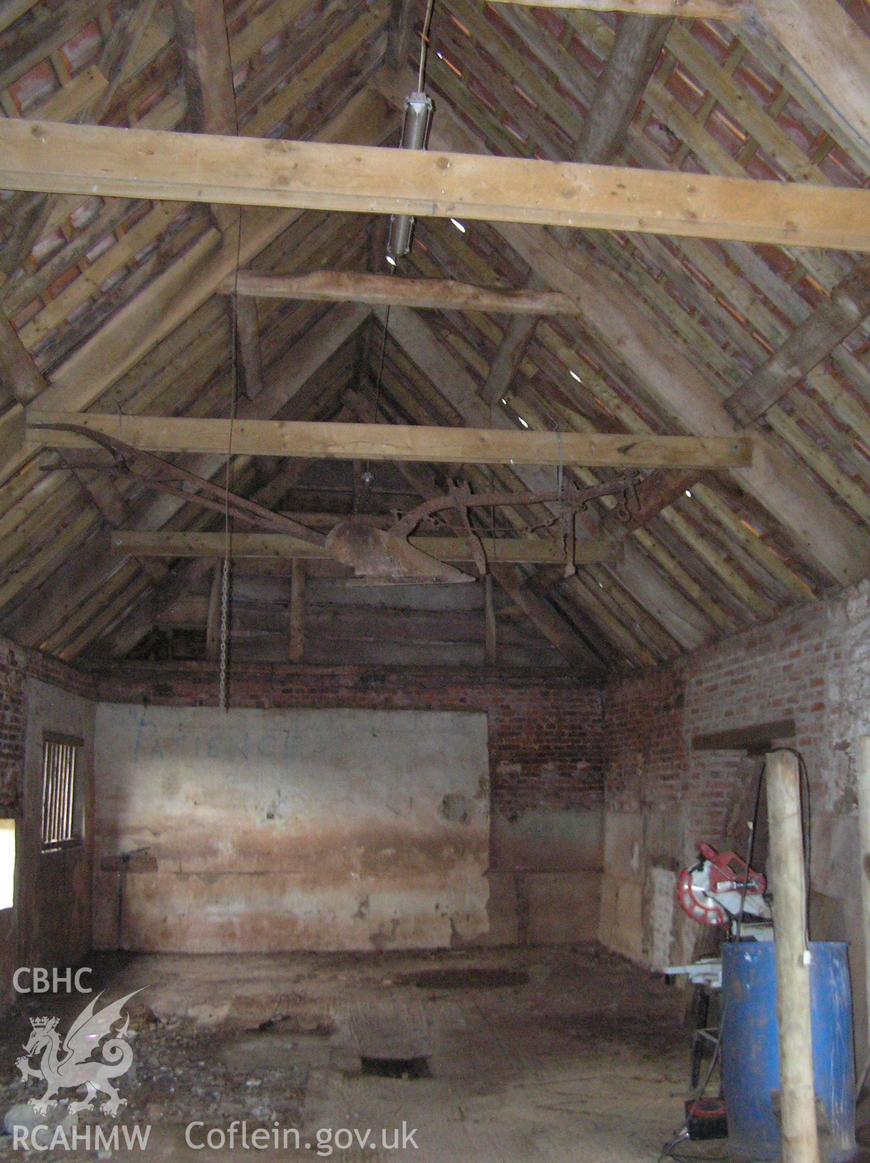 Colour photo showing interior view of the cowhouse looking north, taken by John Wheelock and donated as a condition of planning consent.