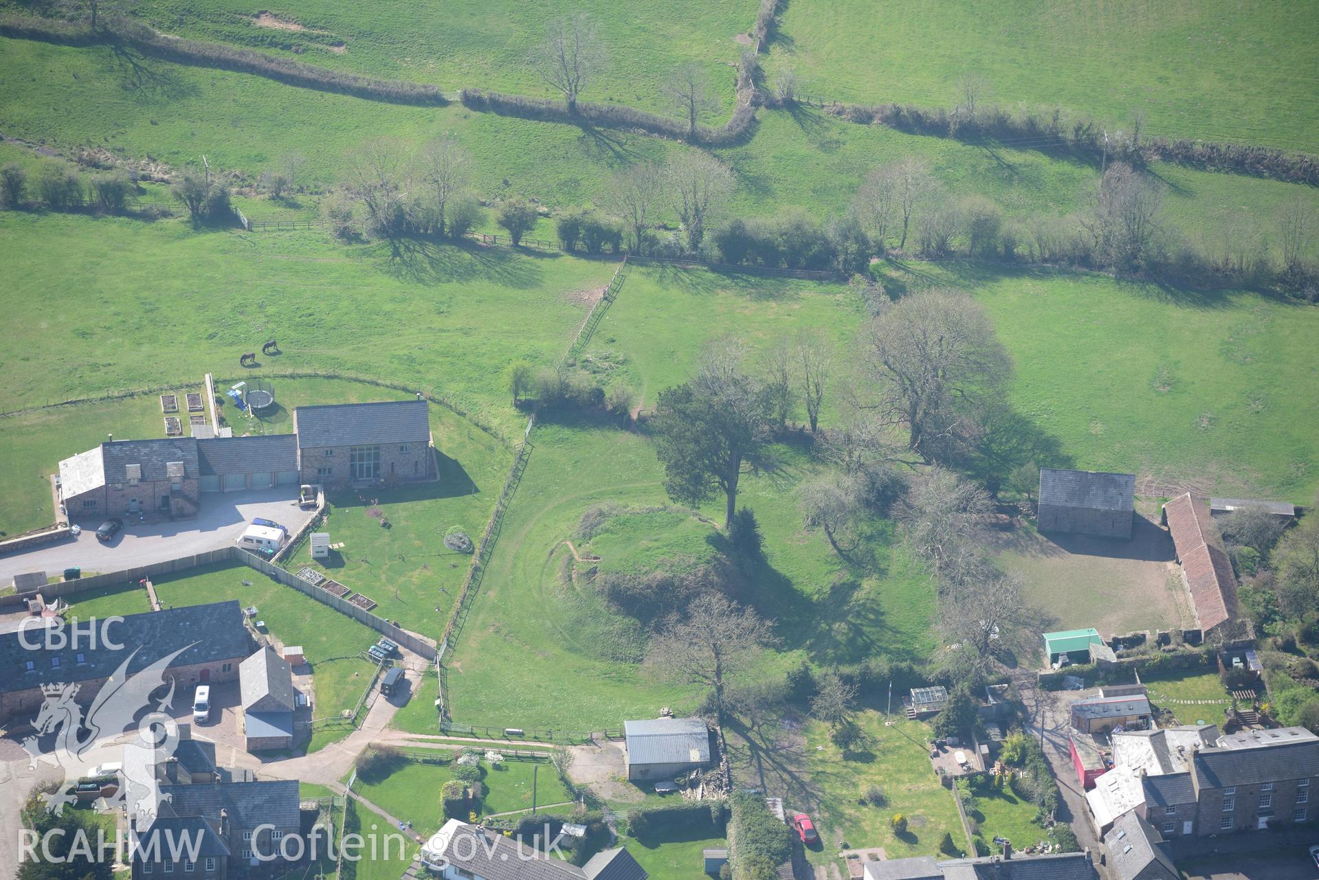 Trellech village and medieval borough including Trellech motte; Tump Terret and Court Farm. Oblique aerial photograph taken during the Royal Commission's programme of archaeological aerial reconnaissance by Toby Driver on 21st April 2015.