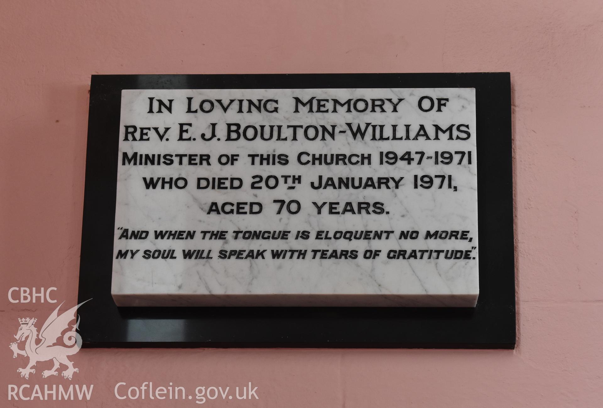 Colour photograph showing detail of memorial plaque dedicated to the Rev. E. J. Boulton-Williams at the Baptist & Unitarian Chapel, Nottage, Porthcawl. Taken during photographic survey conducted by Sue Fielding on 12th May 2018.