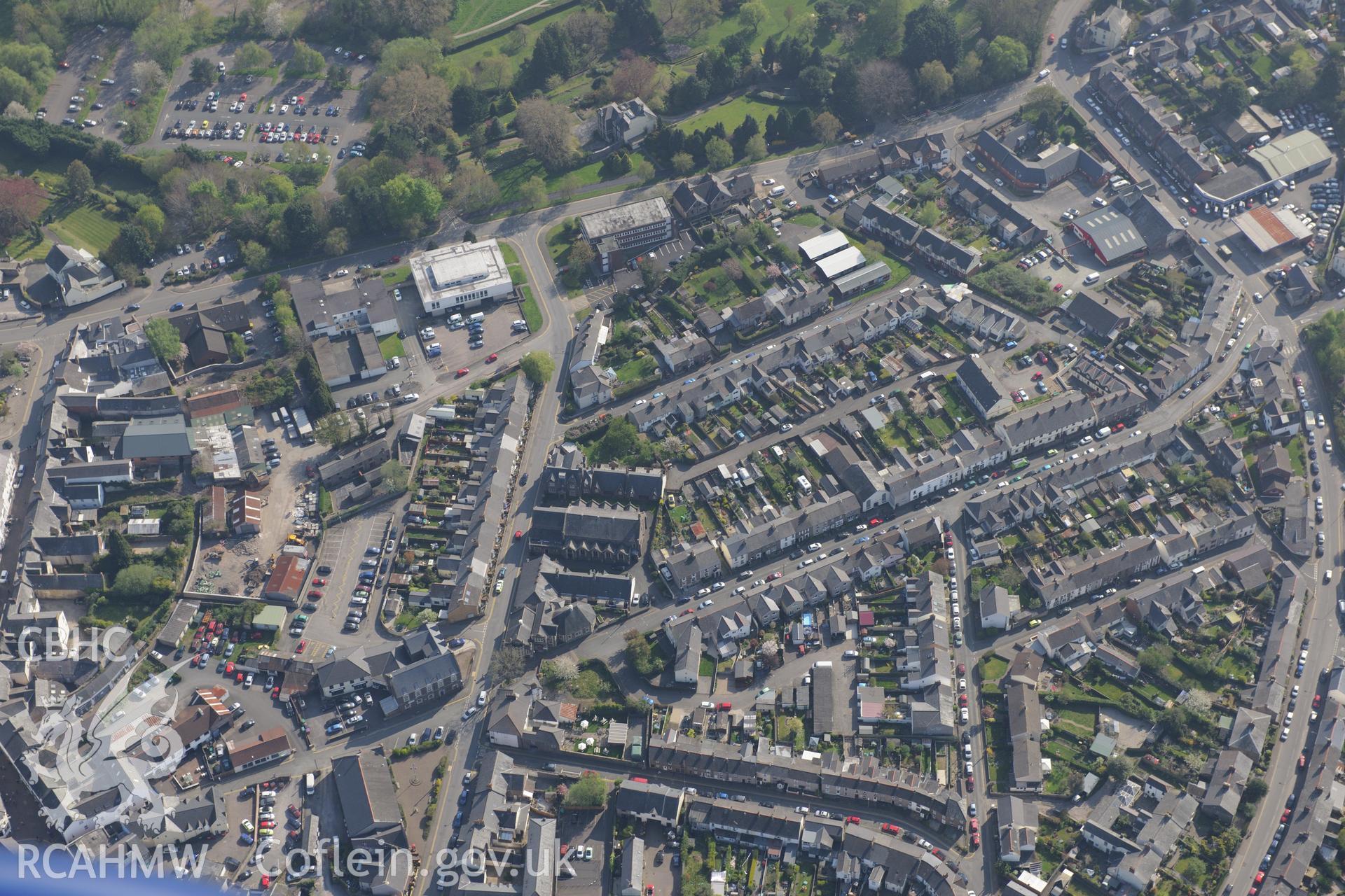 Abergavenny including Holy Trinity Church; Tabernacle Methodist Chapel and Abergavenny Library. Oblique aerial photograph taken during the Royal Commission's programme of archaeological aerial reconnaissance by Toby Driver on 21st April 2015.