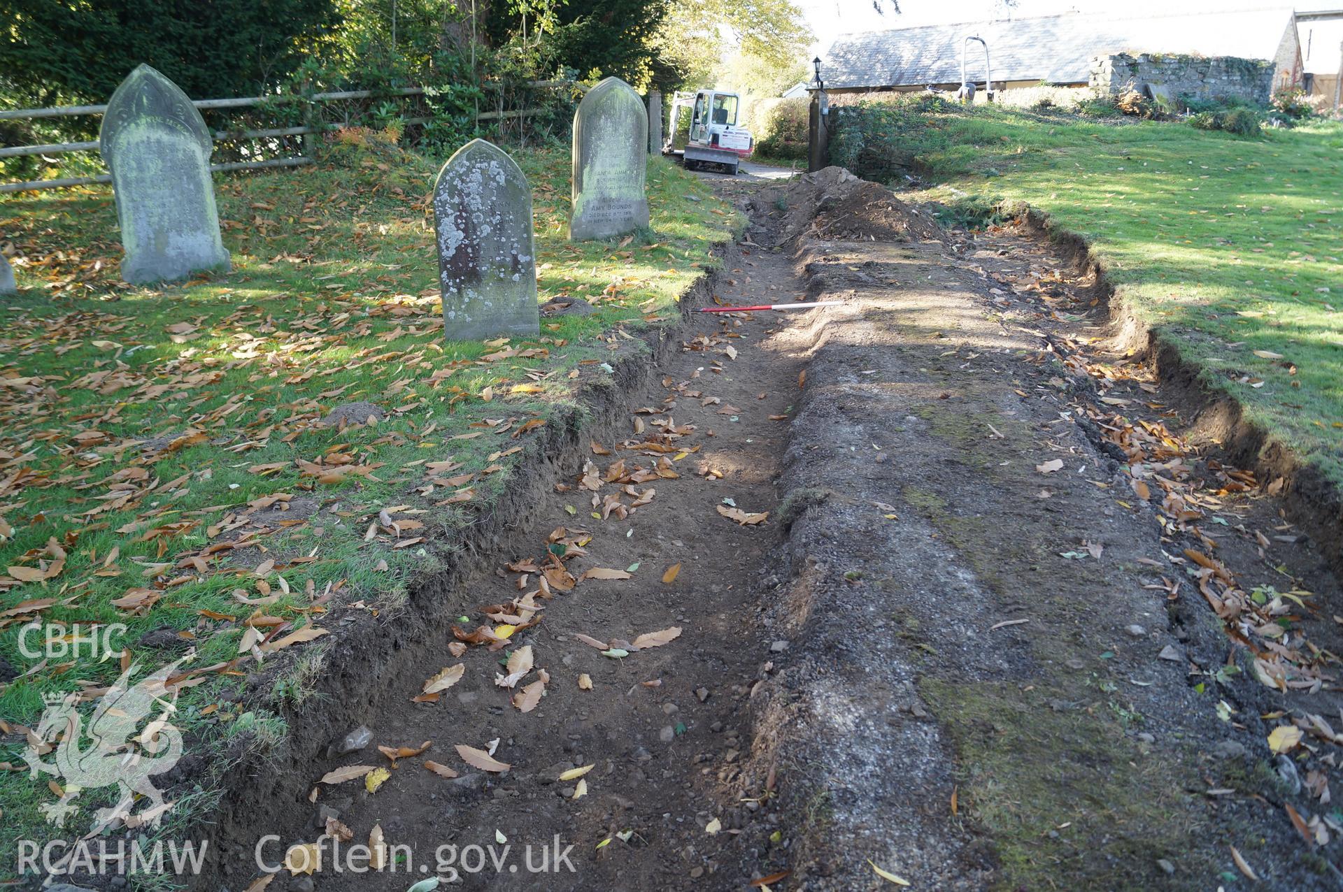 View 'looking west northwest at Trench B after cleaning, showing the central area of the pathway still retained' at St. Mary's, Gladestry, Powys. Photograph & description by Jenny Hall and Paul Sambrook of Trysor, 16th October 2017.