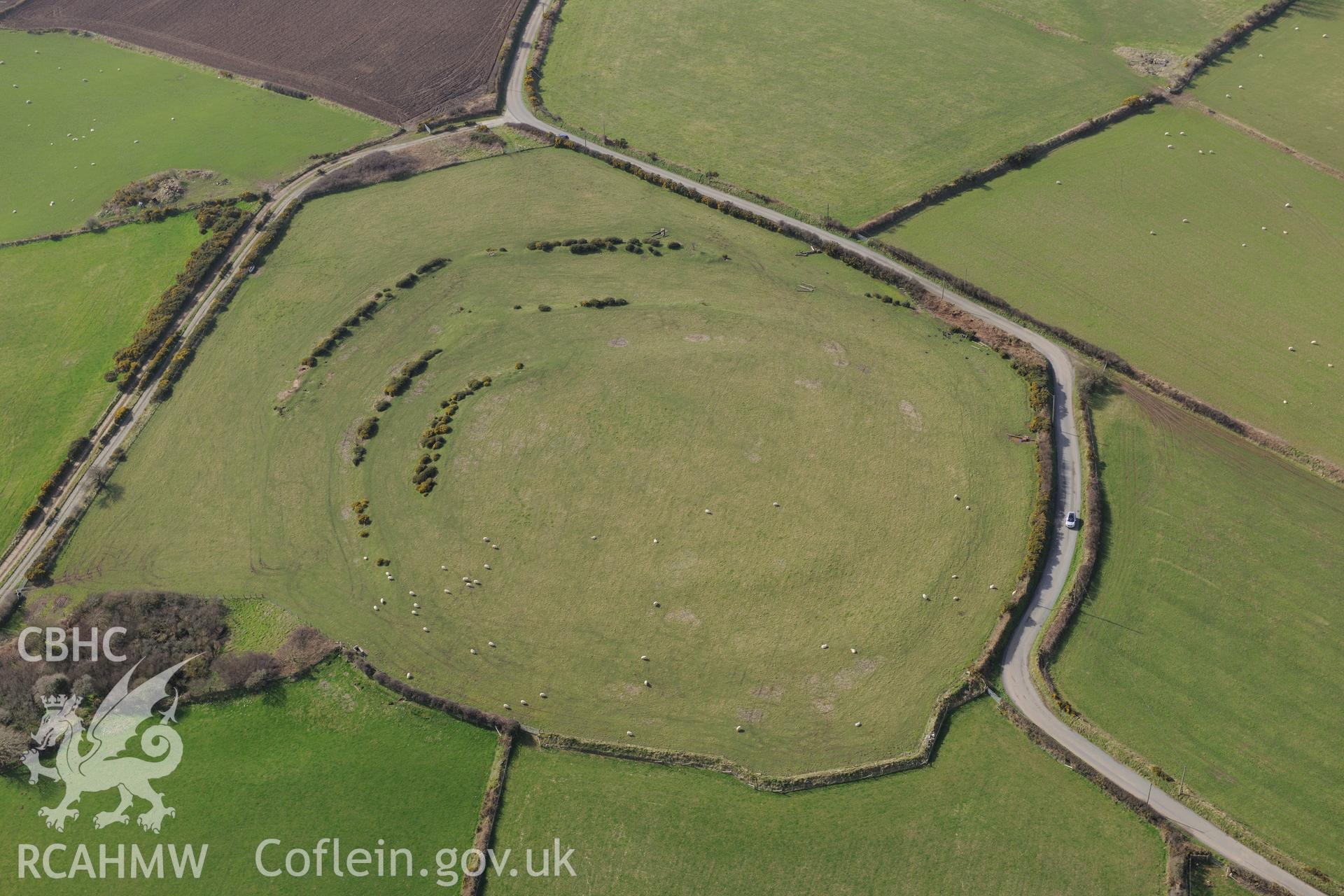 Caerau Gaer defended enclosure, Moylgrove, near Cardigan. Oblique aerial photograph taken during the Royal Commission's programme of archaeological aerial reconnaissance by Toby Driver on 13th March 2015.