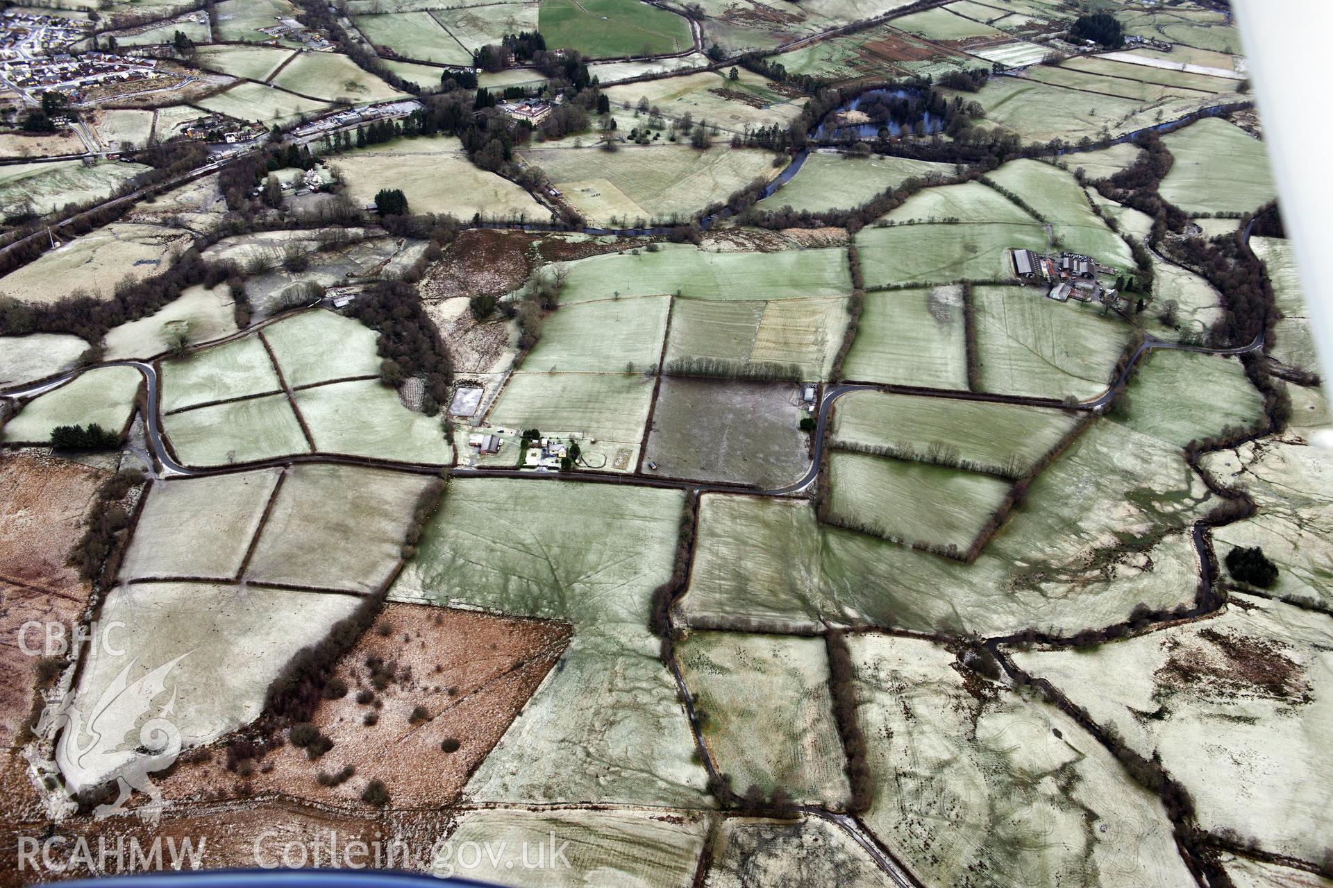 Enclosure north of Glan-Cledan-Fach farm, Llanwrtyd Wells. Oblique aerial photograph taken during the Royal Commission?s programme of archaeological aerial reconnaissance by Toby Driver on 15th January 2013.