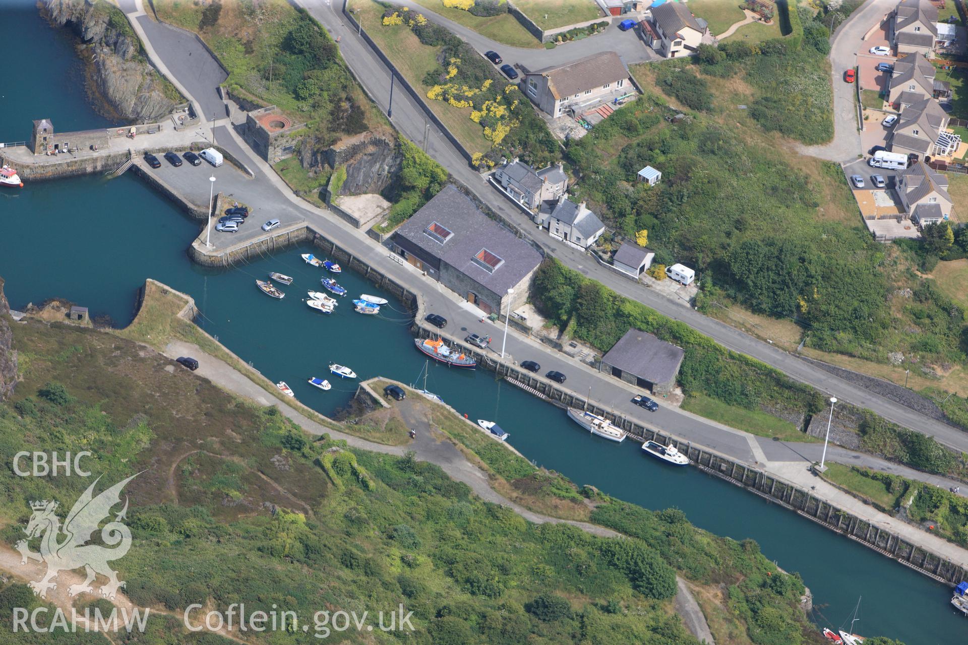 Amlwch harbour, Anglesey. Oblique aerial photograph taken during the Royal Commission?s programme of archaeological aerial reconnaissance by Toby Driver on 12th July 2013.