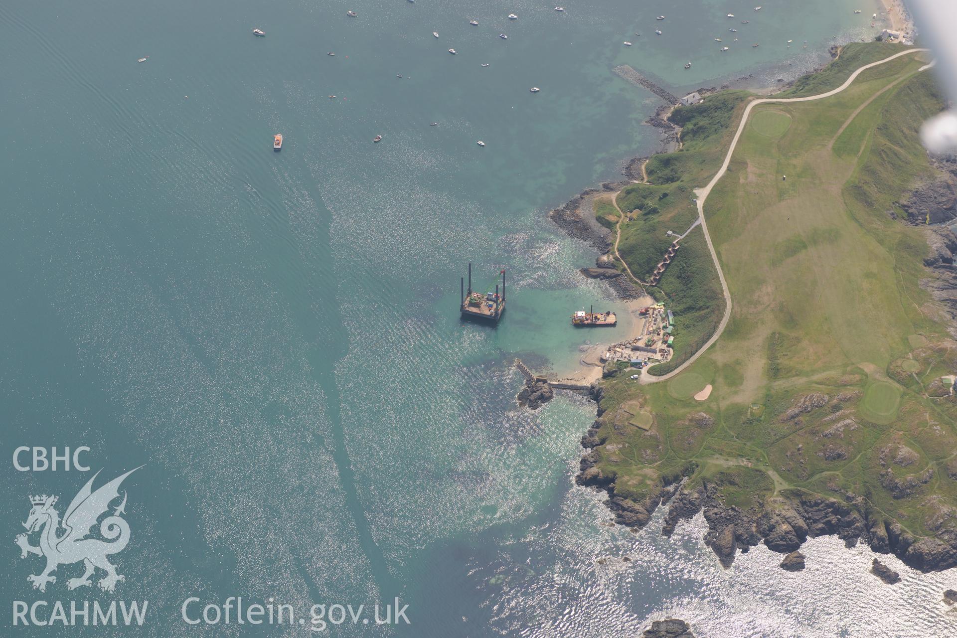 Lifeboat House, Lighthouse, Old Pier and Trwyn Porth Dinllaen Promontory Enclosure, Porth Dinllaen, Morfa Nefyn, on the Lleyn Peninsula. Oblique aerial photograph taken during the Royal Commission?s programme of archaeological aerial reconnaissance by Toby Driver on 12th July 2013.