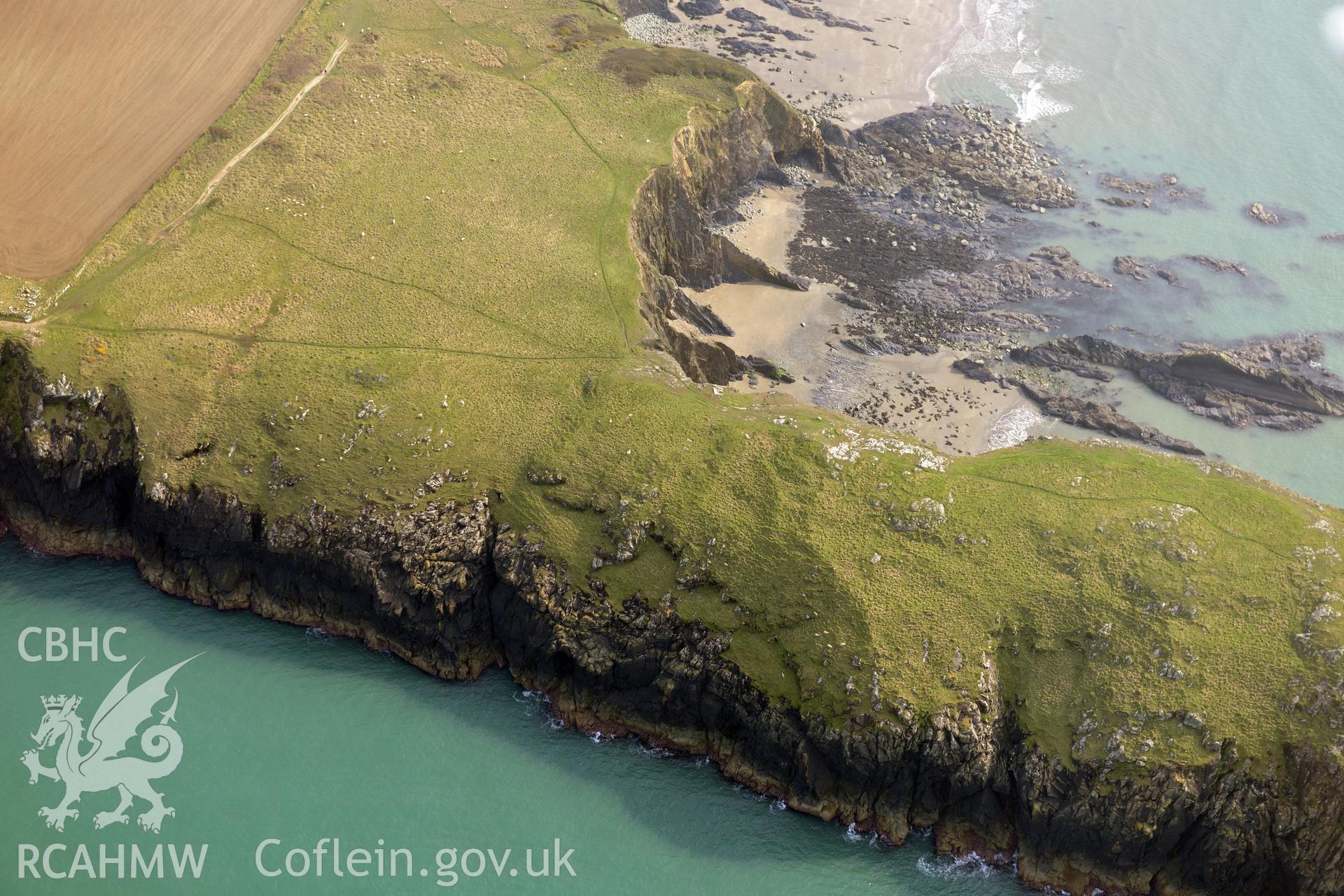 Aerial photography of Porth Egr promontory fort taken on 27th March 2017. Baseline aerial reconnaissance survey for the CHERISH Project. ? Crown: CHERISH PROJECT 2017. Produced with EU funds through the Ireland Wales Co-operation Programme 2014-2020. All material made freely available through the Open Government Licence.