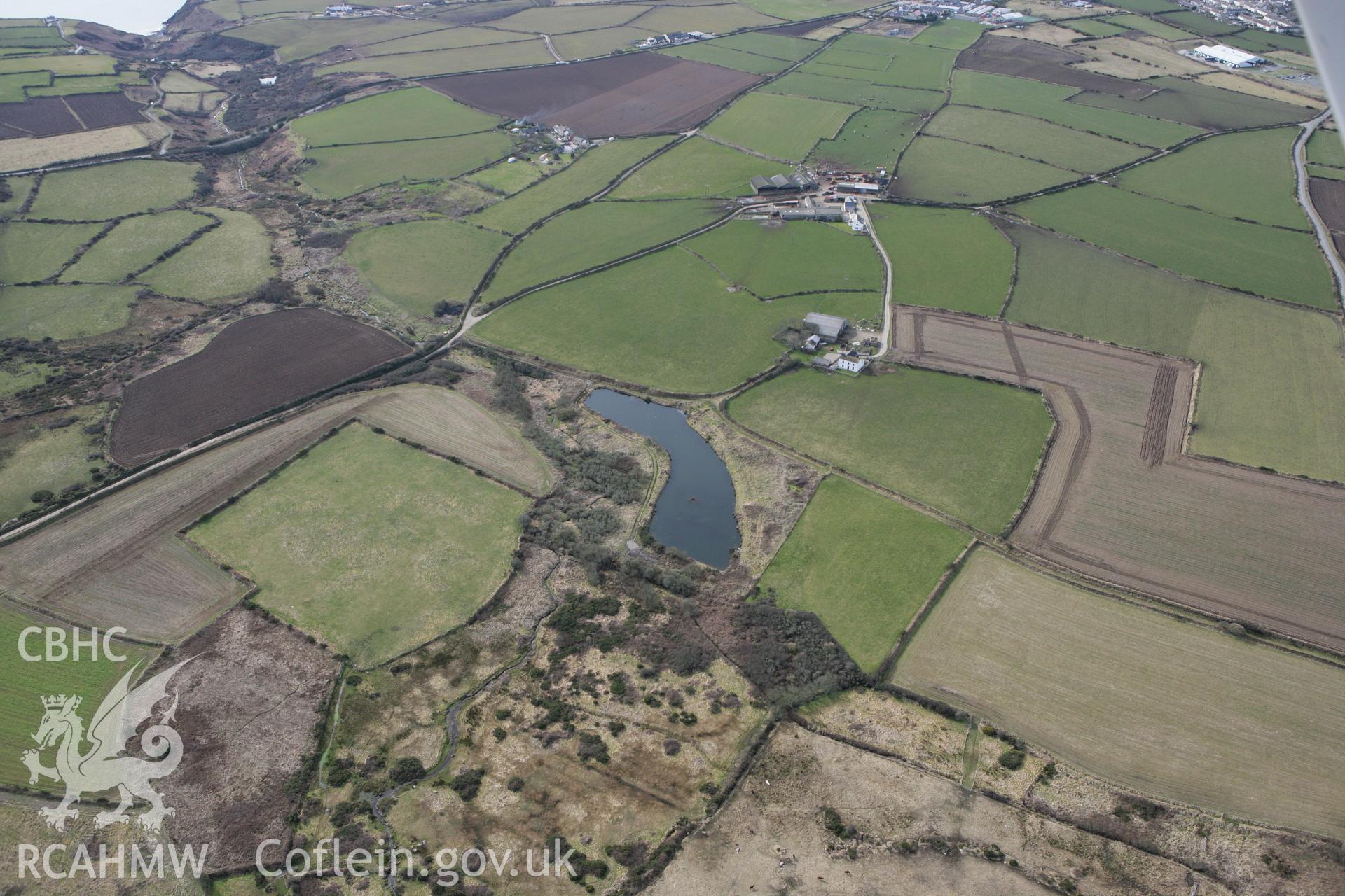 RCAHMW colour oblique aerial photograph of Ffos y Mynach, St Davids. Taken on 02 March 2010 by Toby Driver
