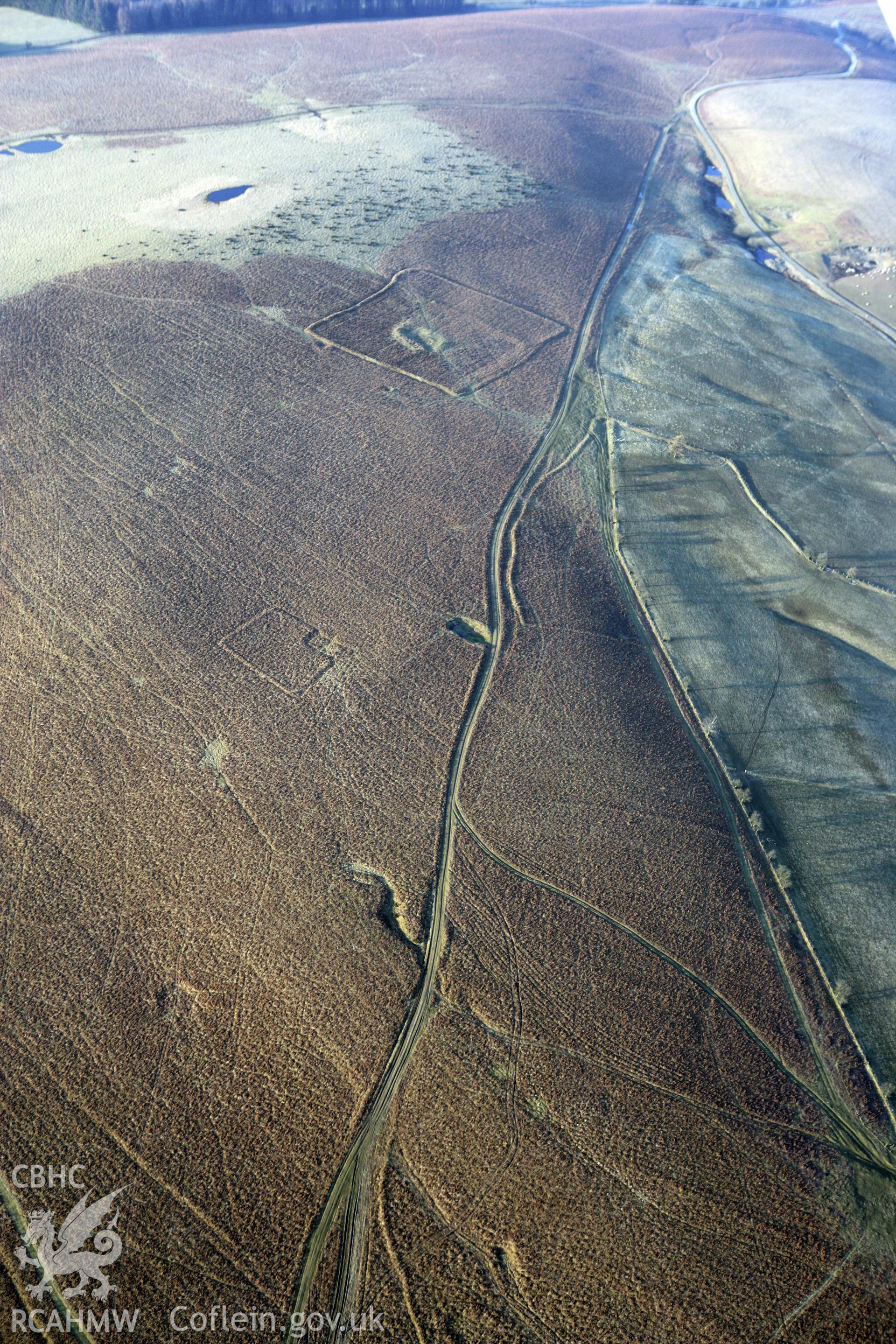 RCAHMW colour oblique photograph of Cwmblaenerw Enclosed Long Hut. Taken by Toby Driver on 11/03/2010.