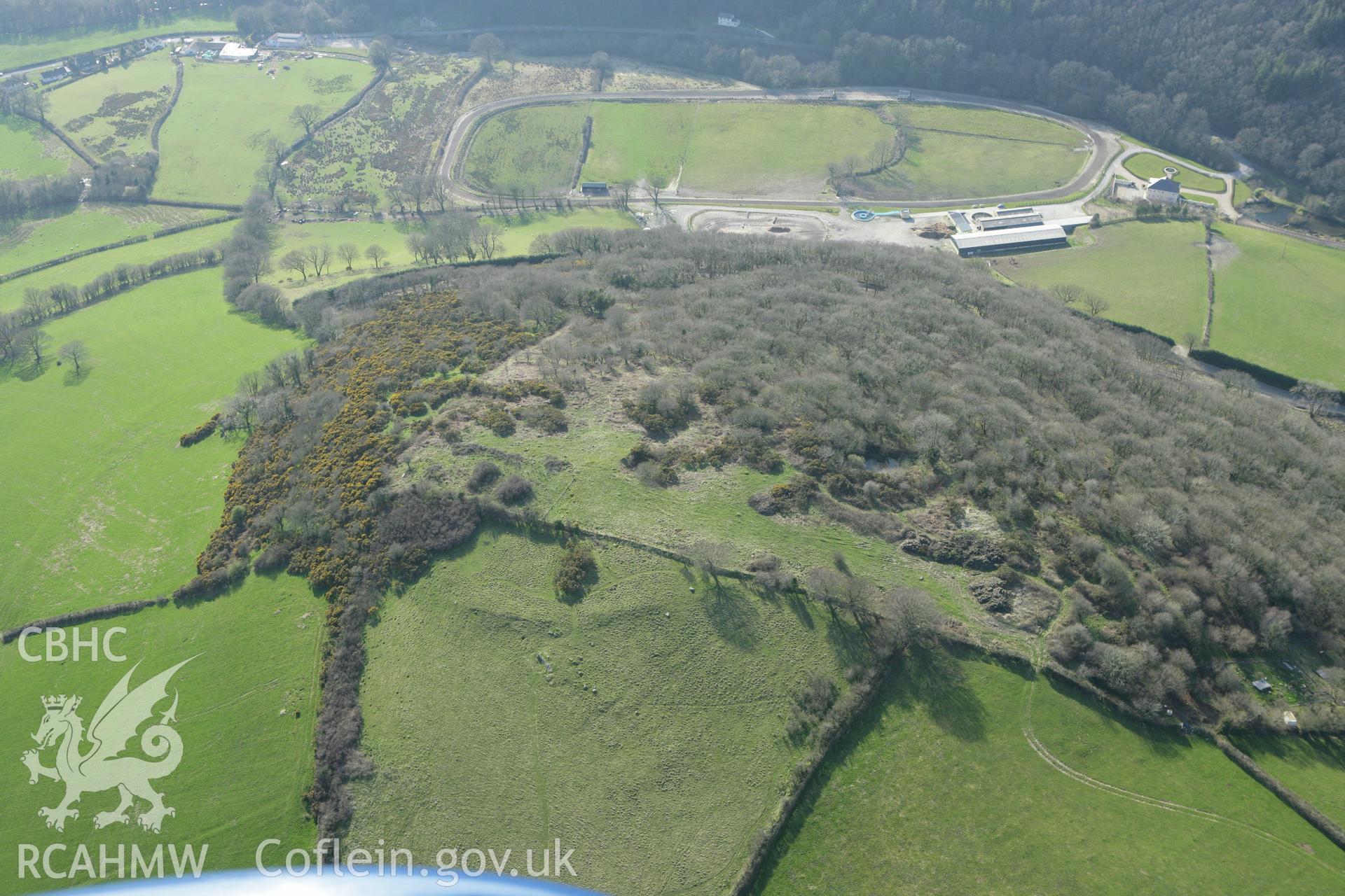 RCAHMW colour oblique aerial photograph of Danycerrig Defended Enclosure. Taken on 13 April 2010 by Toby Driver