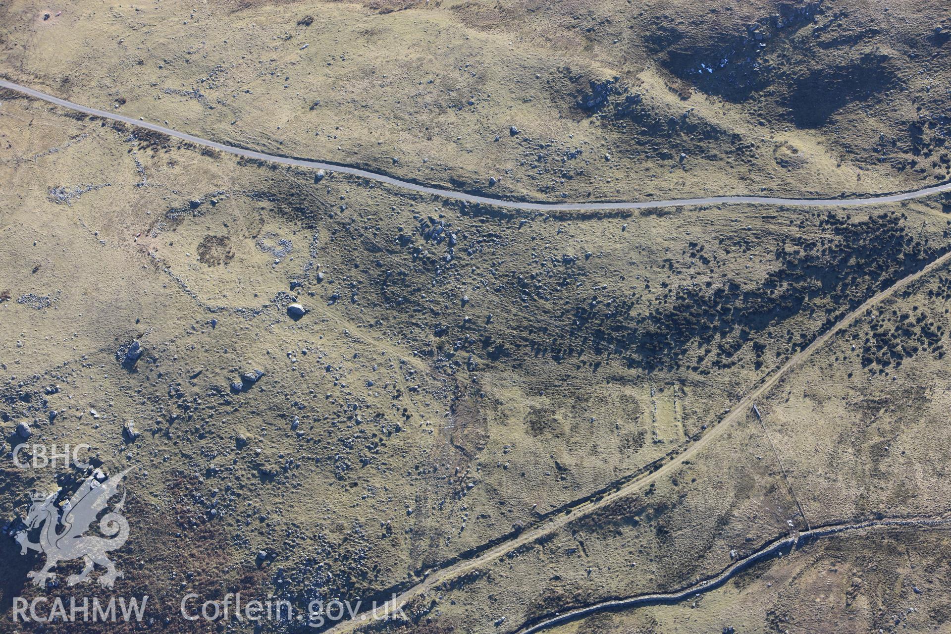 RCAHMW colour oblique photograph of hut circle and early field system on Bryn Seward. Taken by Toby Driver on 08/03/2010.