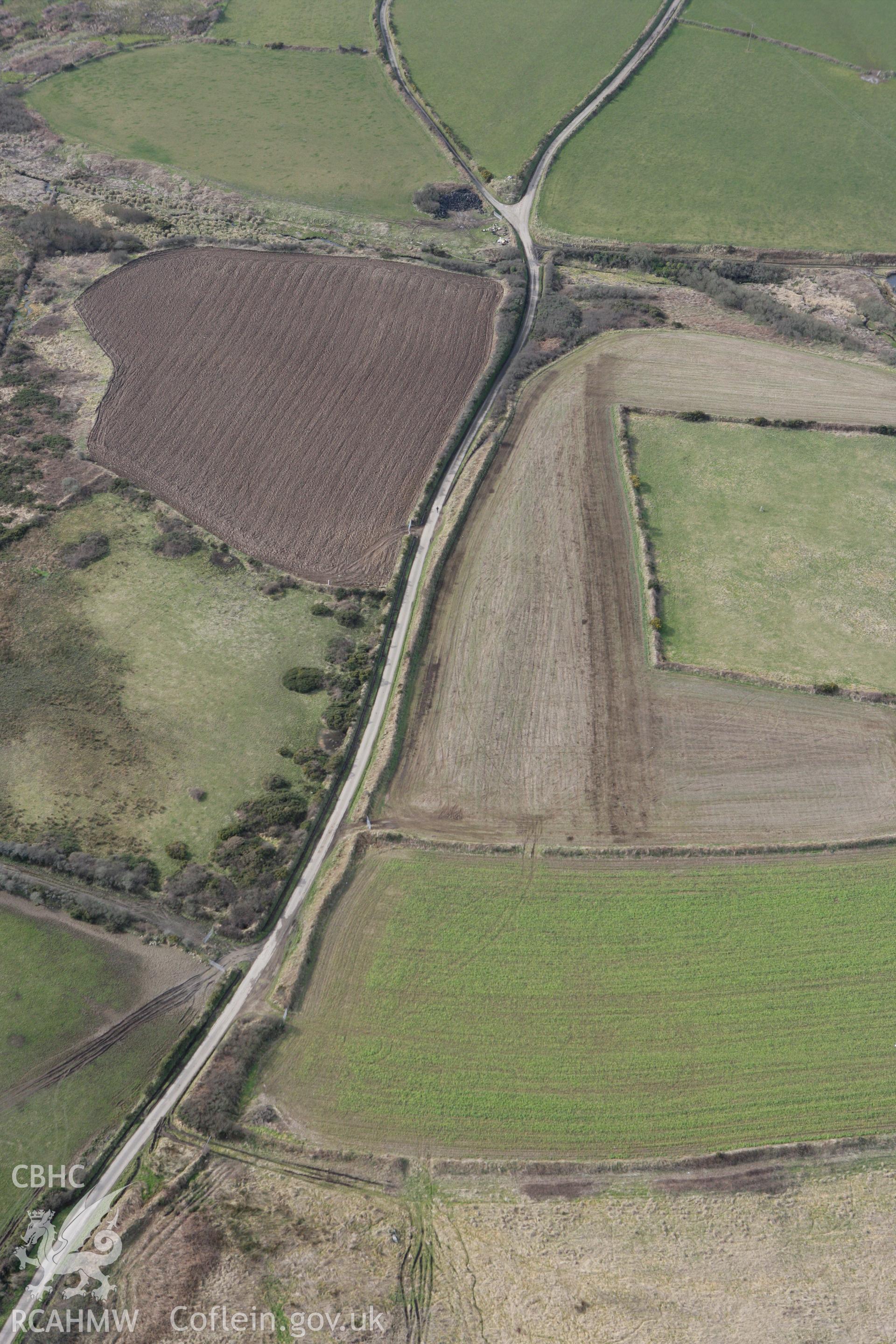 RCAHMW colour oblique aerial photograph of Ffos y Mynach, St Davids. Taken on 02 March 2010 by Toby Driver