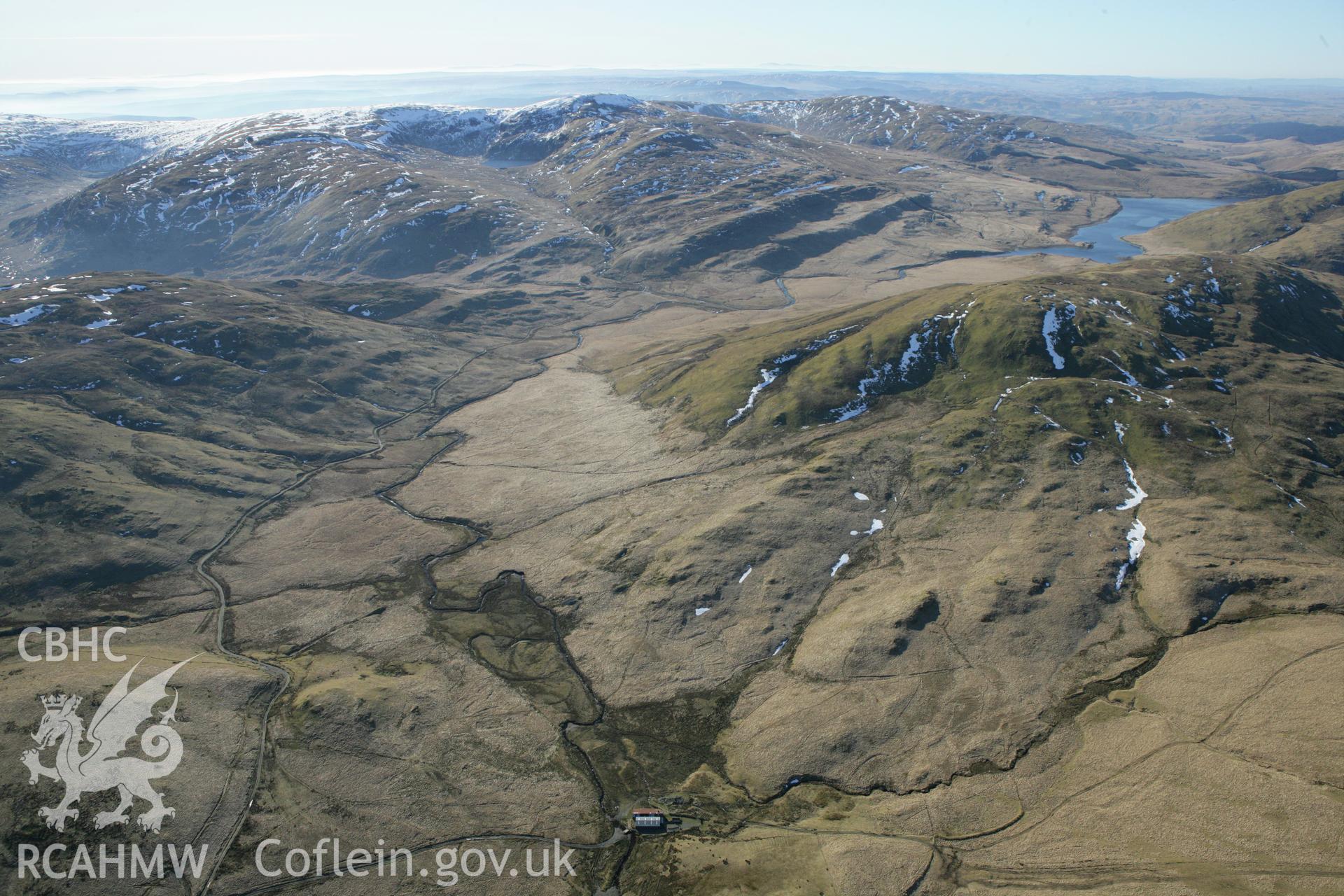 RCAHMW colour oblique photograph of Hyddgen lead mine, with Nant y moch reservoir, from the north. Taken by Toby Driver on 08/03/2010.